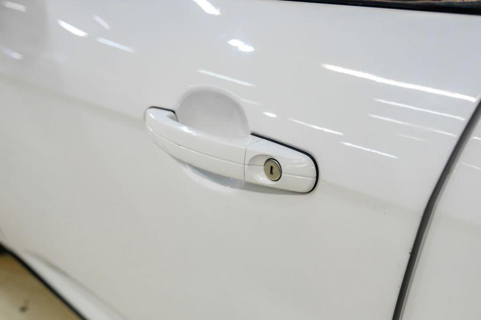 2017 Oxford White /Black Ford Focus SE (1FADP3F23HL) with an 2.0L 4-Cylinder DGI Flex Fuel Turbocharged DOHC engine, Automatic transmission, located at 15300 Midway Rd., Addison, TX, 75001, (972) 702-0011, 32.958321, -96.838074 - Photo#35