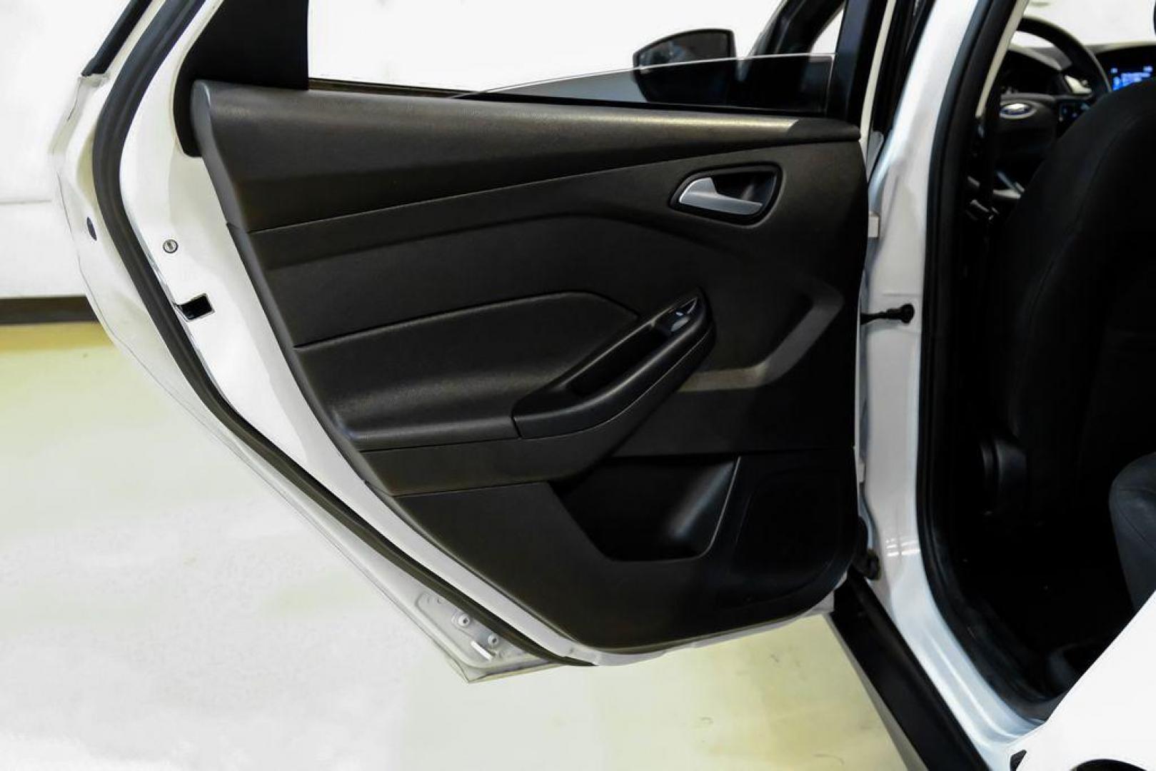 2017 Oxford White /Black Ford Focus SE (1FADP3F23HL) with an 2.0L 4-Cylinder DGI Flex Fuel Turbocharged DOHC engine, Automatic transmission, located at 15300 Midway Rd., Addison, TX, 75001, (972) 702-0011, 32.958321, -96.838074 - Photo#41