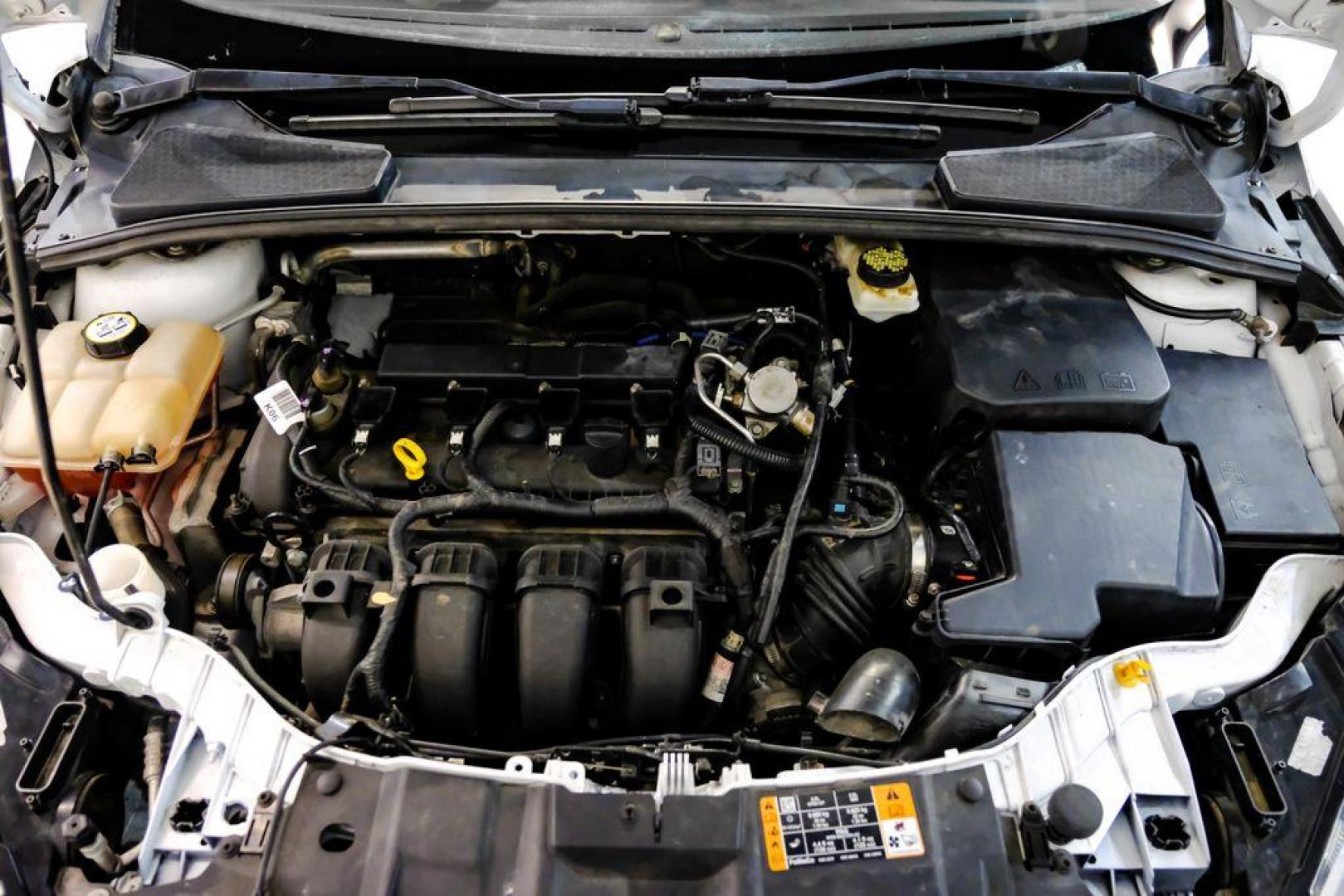 2017 Oxford White /Black Ford Focus SE (1FADP3F23HL) with an 2.0L 4-Cylinder DGI Flex Fuel Turbocharged DOHC engine, Automatic transmission, located at 15300 Midway Rd., Addison, TX, 75001, (972) 702-0011, 32.958321, -96.838074 - Photo#46