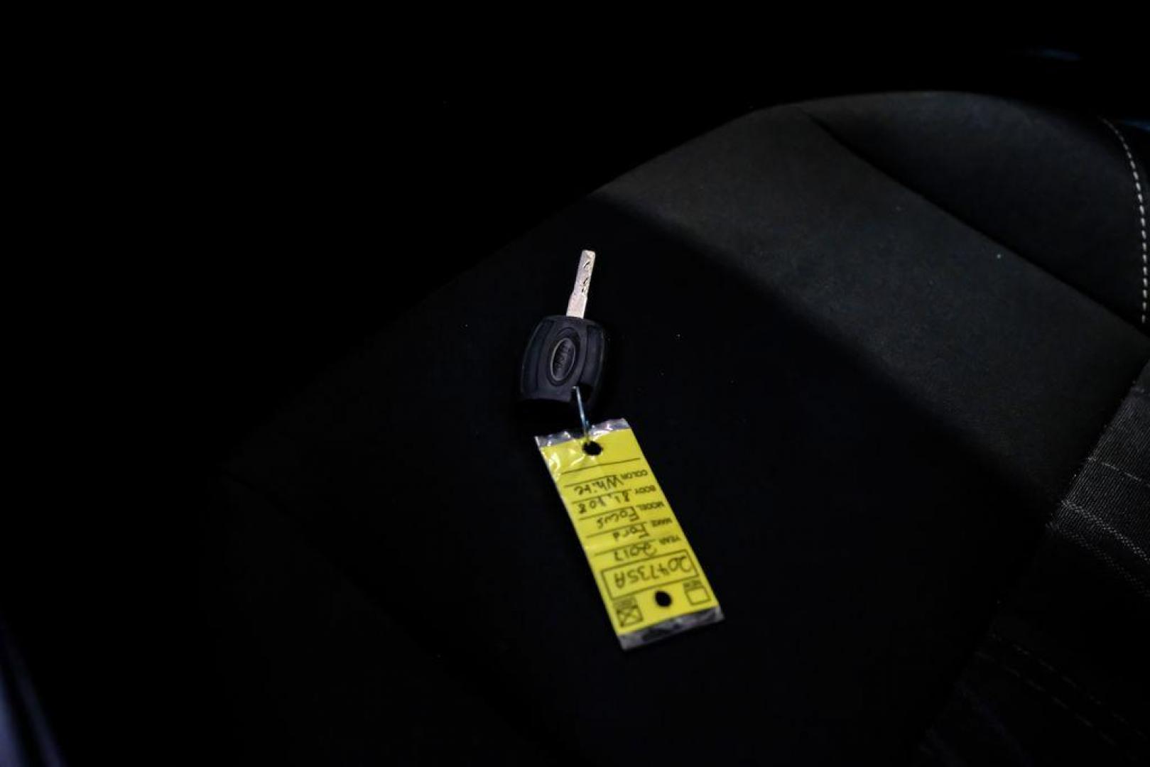 2017 Oxford White /Black Ford Focus SE (1FADP3F23HL) with an 2.0L 4-Cylinder DGI Flex Fuel Turbocharged DOHC engine, Automatic transmission, located at 15300 Midway Rd., Addison, TX, 75001, (972) 702-0011, 32.958321, -96.838074 - Photo#53