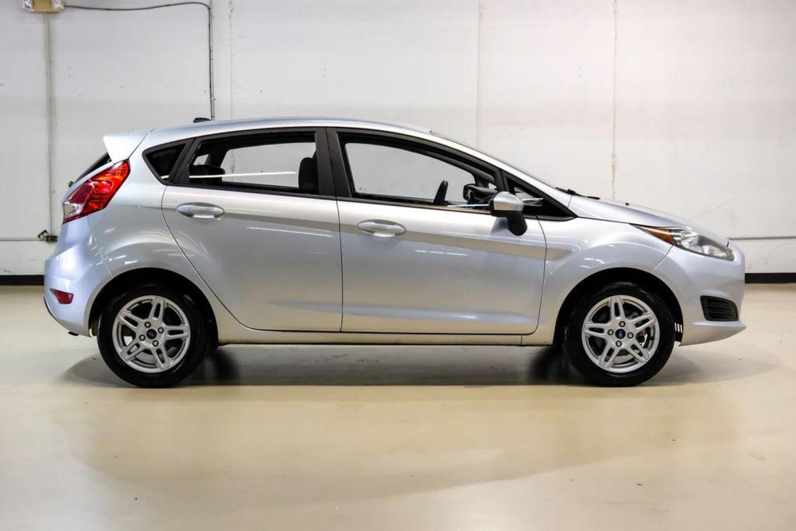 2019 Ingot Silver /Medium Light Stone Ford Fiesta SE (3FADP4EJ1KM) with an 1.6L I4 Ti-VCT engine, Automatic transmission, located at 15300 Midway Rd., Addison, TX, 75001, (972) 702-0011, 32.958321, -96.838074 - Photo#5