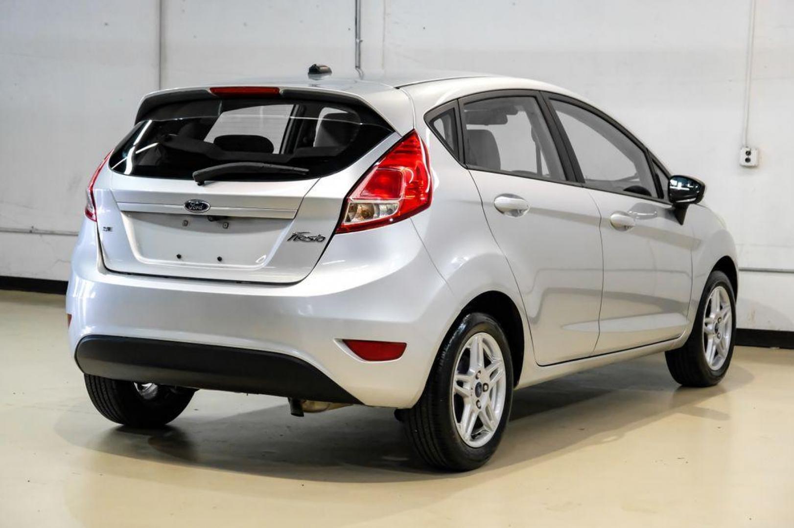 2019 Ingot Silver /Medium Light Stone Ford Fiesta SE (3FADP4EJ1KM) with an 1.6L I4 Ti-VCT engine, Automatic transmission, located at 15300 Midway Rd., Addison, TX, 75001, (972) 702-0011, 32.958321, -96.838074 - Photo#6