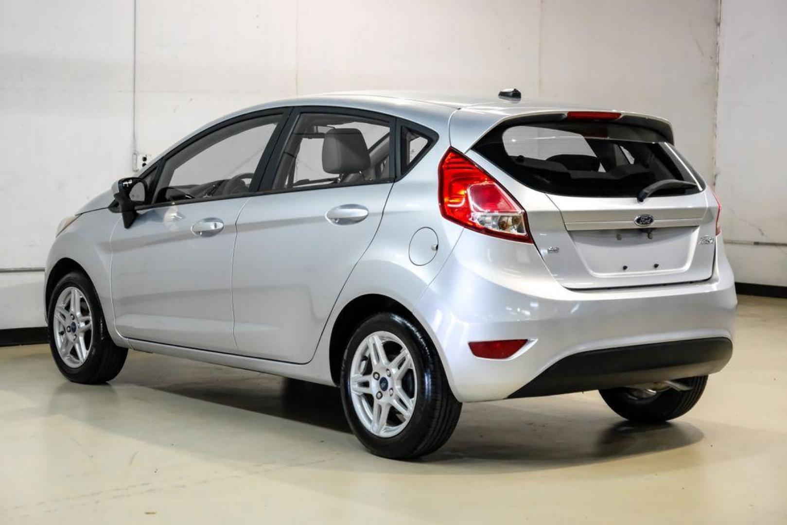 2019 Ingot Silver /Medium Light Stone Ford Fiesta SE (3FADP4EJ1KM) with an 1.6L I4 Ti-VCT engine, Automatic transmission, located at 15300 Midway Rd., Addison, TX, 75001, (972) 702-0011, 32.958321, -96.838074 - Photo#8