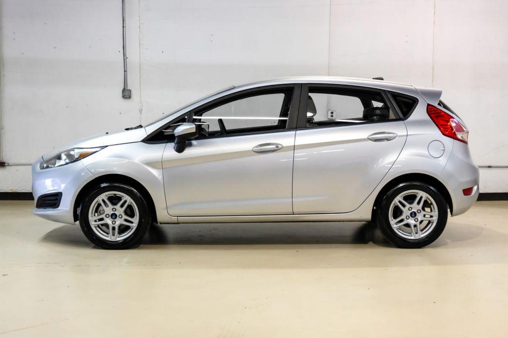 2019 Ingot Silver /Medium Light Stone Ford Fiesta SE (3FADP4EJ1KM) with an 1.6L I4 Ti-VCT engine, Automatic transmission, located at 15300 Midway Rd., Addison, TX, 75001, (972) 702-0011, 32.958321, -96.838074 - Photo#9