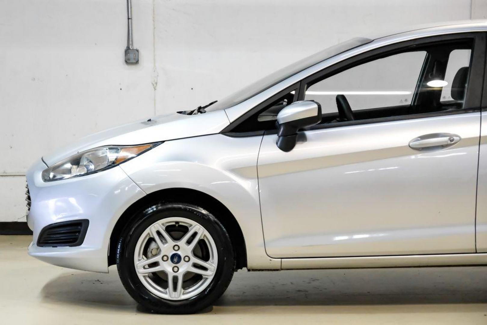 2019 Ingot Silver /Medium Light Stone Ford Fiesta SE (3FADP4EJ1KM) with an 1.6L I4 Ti-VCT engine, Automatic transmission, located at 15300 Midway Rd., Addison, TX, 75001, (972) 702-0011, 32.958321, -96.838074 - Photo#10