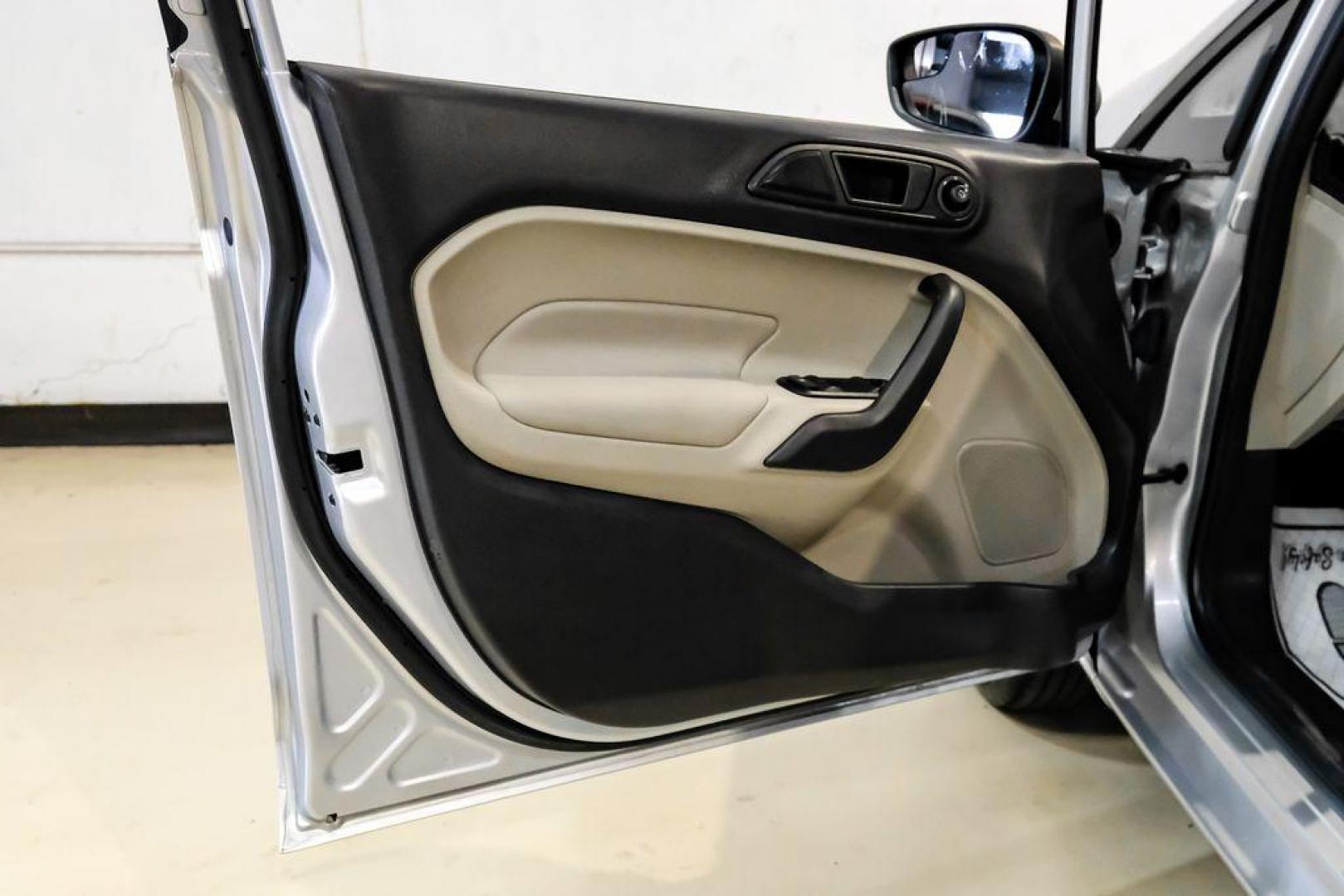 2019 Ingot Silver /Medium Light Stone Ford Fiesta SE (3FADP4EJ1KM) with an 1.6L I4 Ti-VCT engine, Automatic transmission, located at 15300 Midway Rd., Addison, TX, 75001, (972) 702-0011, 32.958321, -96.838074 - Photo#37