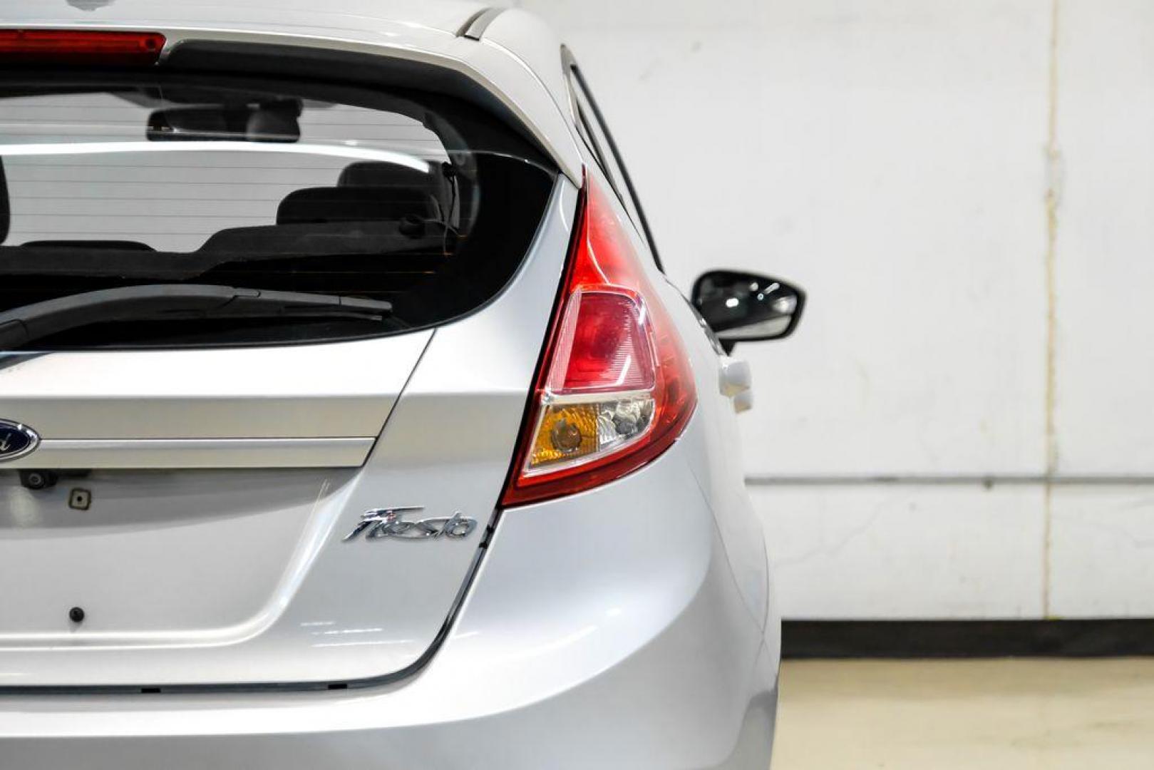 2019 Ingot Silver /Medium Light Stone Ford Fiesta SE (3FADP4EJ1KM) with an 1.6L I4 Ti-VCT engine, Automatic transmission, located at 15300 Midway Rd., Addison, TX, 75001, (972) 702-0011, 32.958321, -96.838074 - Photo#42