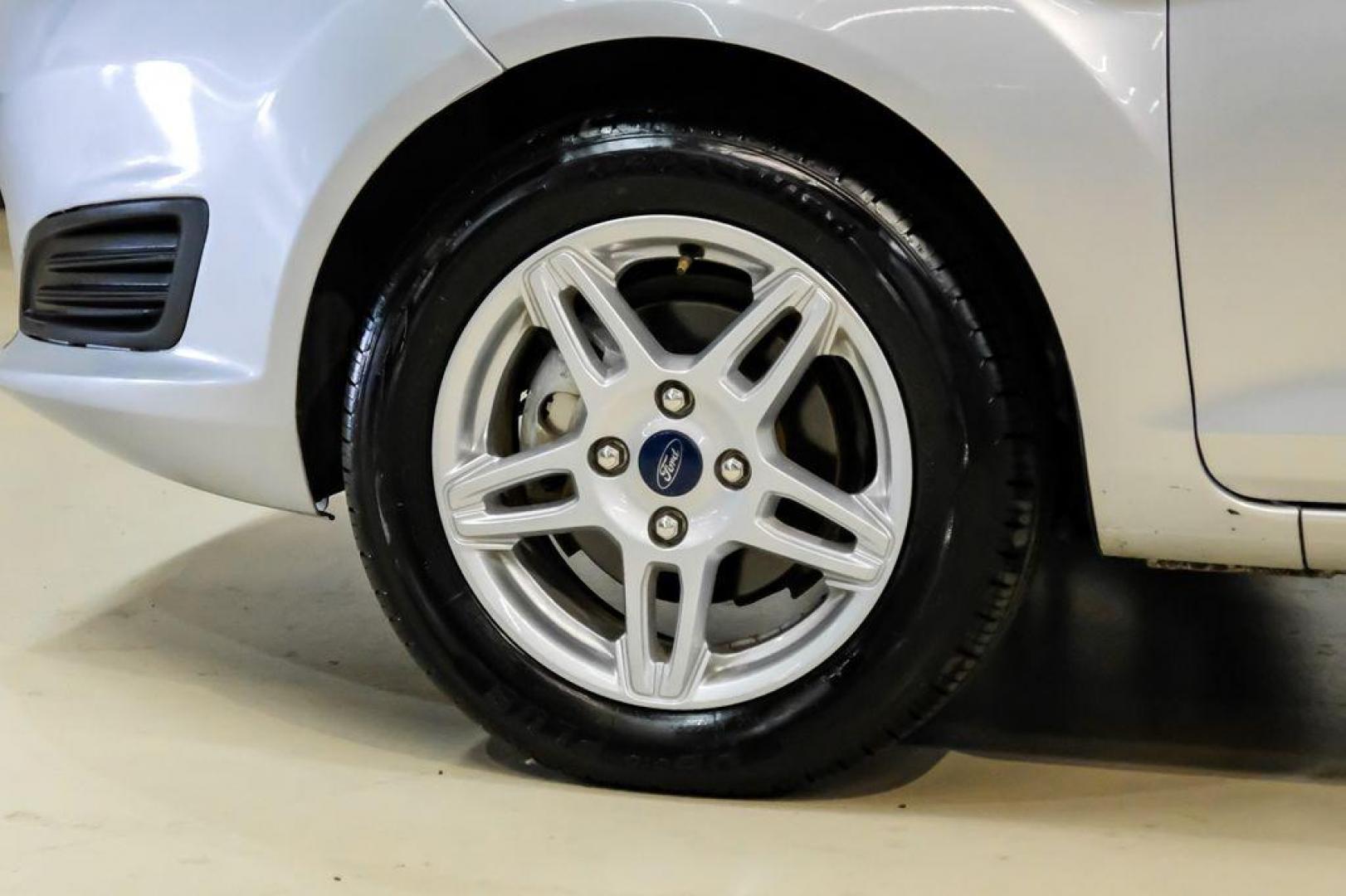 2019 Ingot Silver /Medium Light Stone Ford Fiesta SE (3FADP4EJ1KM) with an 1.6L I4 Ti-VCT engine, Automatic transmission, located at 15300 Midway Rd., Addison, TX, 75001, (972) 702-0011, 32.958321, -96.838074 - Photo#49