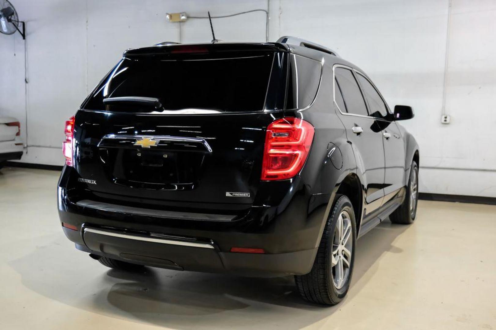 2017 Black Metallic /Jet Black Chevrolet Equinox Premier (2GNALDEK3H1) with an 2.4L 4-Cylinder SIDI DOHC VVT engine, Automatic transmission, located at 15300 Midway Rd., Addison, TX, 75001, (972) 702-0011, 32.958321, -96.838074 - Photo#8