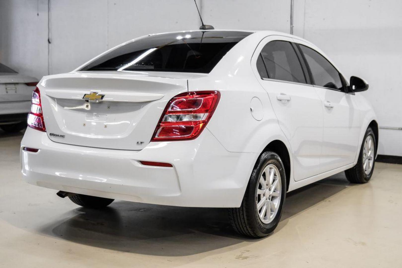 2019 Summit White /Jet Black/Dark Titanium Chevrolet Sonic LT (1G1JD5SB7K4) with an I4 engine, Automatic transmission, located at 15300 Midway Rd., Addison, TX, 75001, (972) 702-0011, 32.958321, -96.838074 - Photo#7