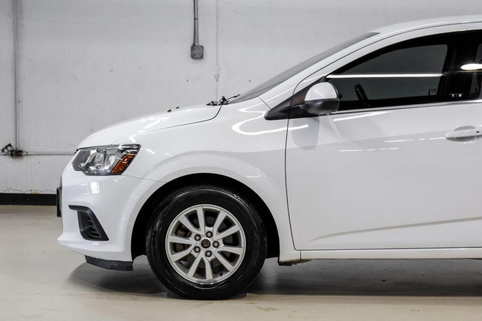 2019 Summit White /Jet Black/Dark Titanium Chevrolet Sonic LT (1G1JD5SB7K4) with an I4 engine, Automatic transmission, located at 15300 Midway Rd., Addison, TX, 75001, (972) 702-0011, 32.958321, -96.838074 - Photo#11