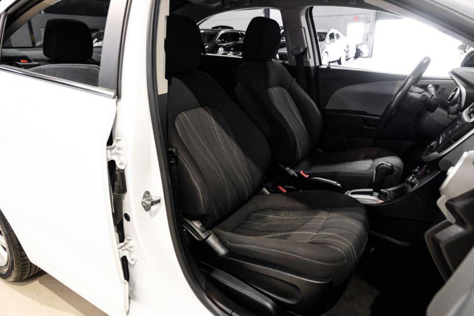 2019 Summit White /Jet Black/Dark Titanium Chevrolet Sonic LT (1G1JD5SB7K4) with an I4 engine, Automatic transmission, located at 15300 Midway Rd., Addison, TX, 75001, (972) 702-0011, 32.958321, -96.838074 - Photo#30