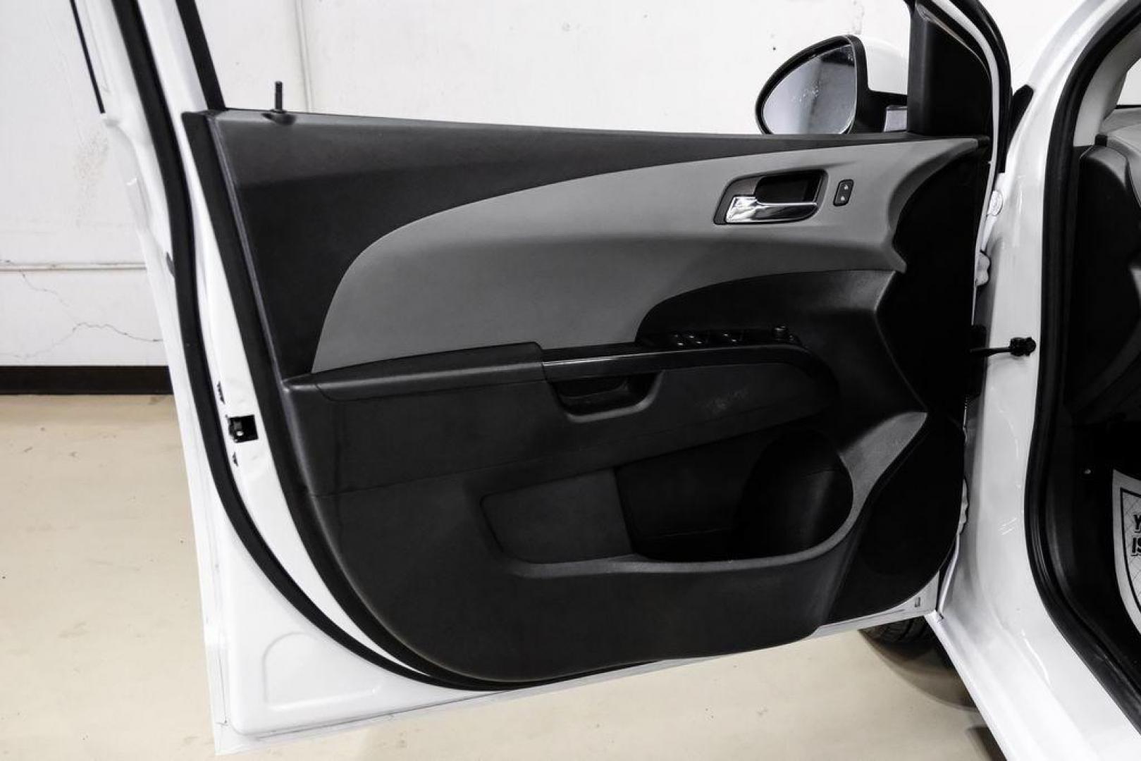 2019 Summit White /Jet Black/Dark Titanium Chevrolet Sonic LT (1G1JD5SB7K4) with an I4 engine, Automatic transmission, located at 15300 Midway Rd., Addison, TX, 75001, (972) 702-0011, 32.958321, -96.838074 - Photo#40