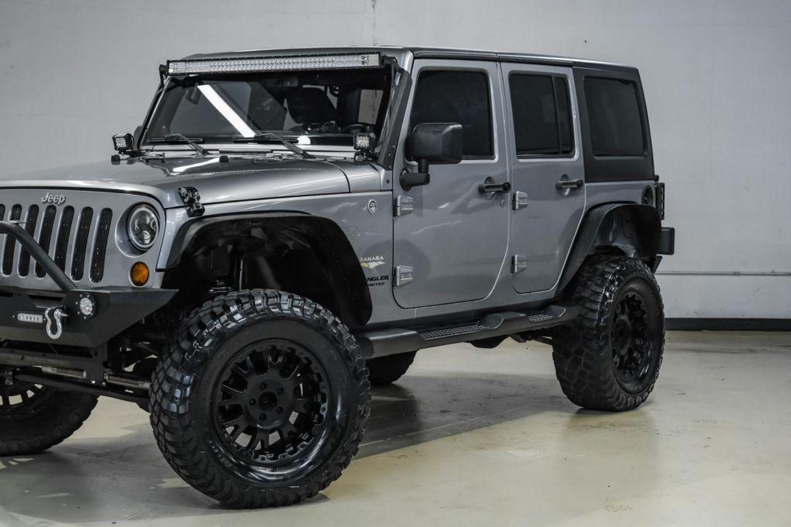 2013 Billet Metallic Clearcoat /Black Interior Jeep Wrangler Unlimited Sahara (1C4BJWEG8DL) with an 3.6L V6 24V VVT engine, Automatic transmission, located at 15300 Midway Rd., Addison, TX, 75001, (972) 702-0011, 32.958321, -96.838074 - Photo#5