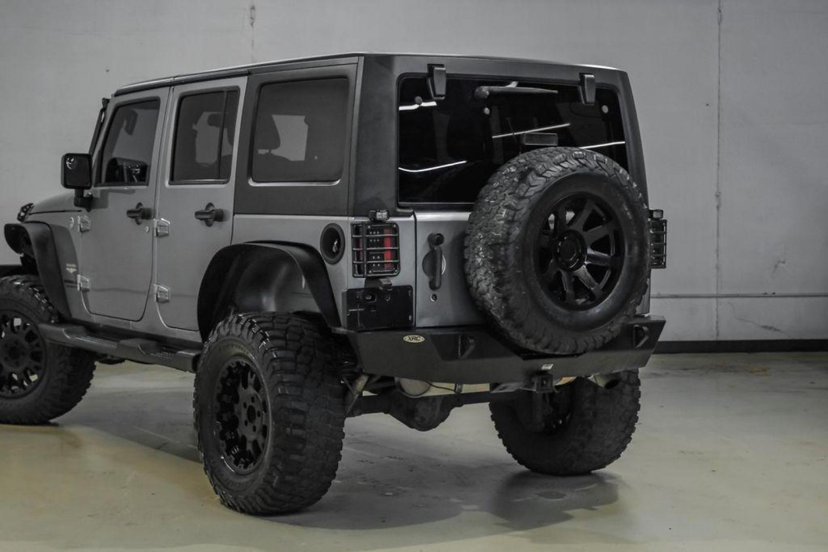 2013 Billet Metallic Clearcoat /Black Interior Jeep Wrangler Unlimited Sahara (1C4BJWEG8DL) with an 3.6L V6 24V VVT engine, Automatic transmission, located at 15300 Midway Rd., Addison, TX, 75001, (972) 702-0011, 32.958321, -96.838074 - Photo#13