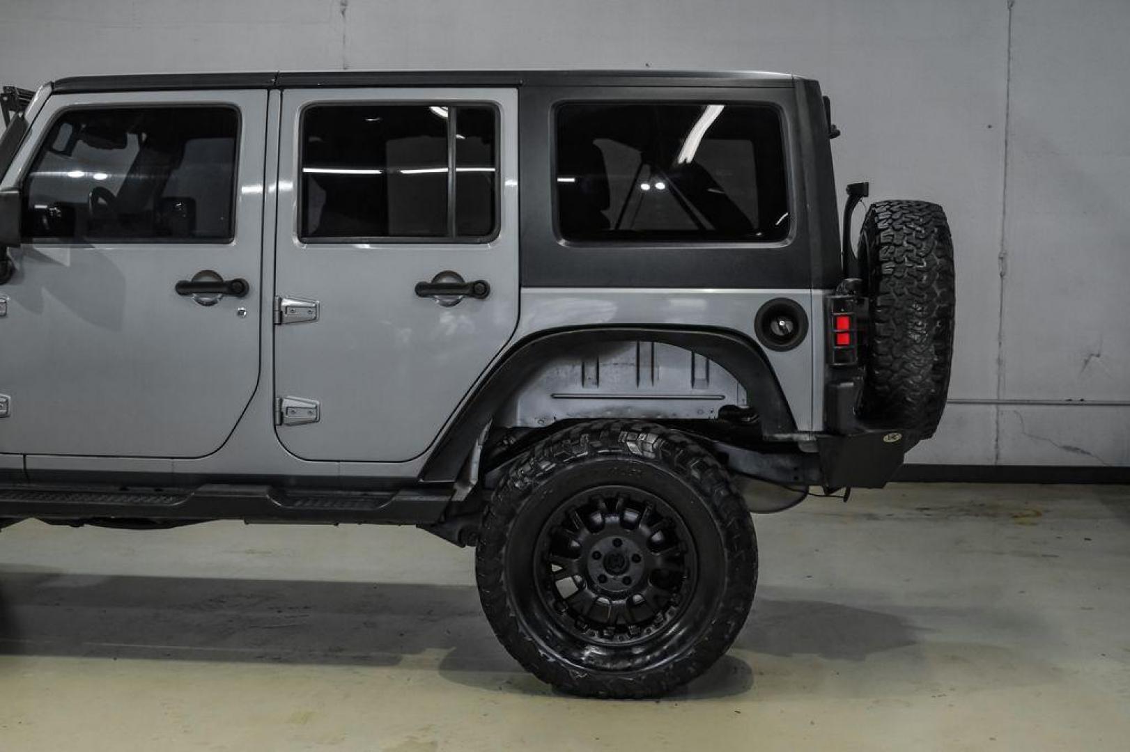 2013 Billet Metallic Clearcoat /Black Interior Jeep Wrangler Unlimited Sahara (1C4BJWEG8DL) with an 3.6L V6 24V VVT engine, Automatic transmission, located at 15300 Midway Rd., Addison, TX, 75001, (972) 702-0011, 32.958321, -96.838074 - Photo#16