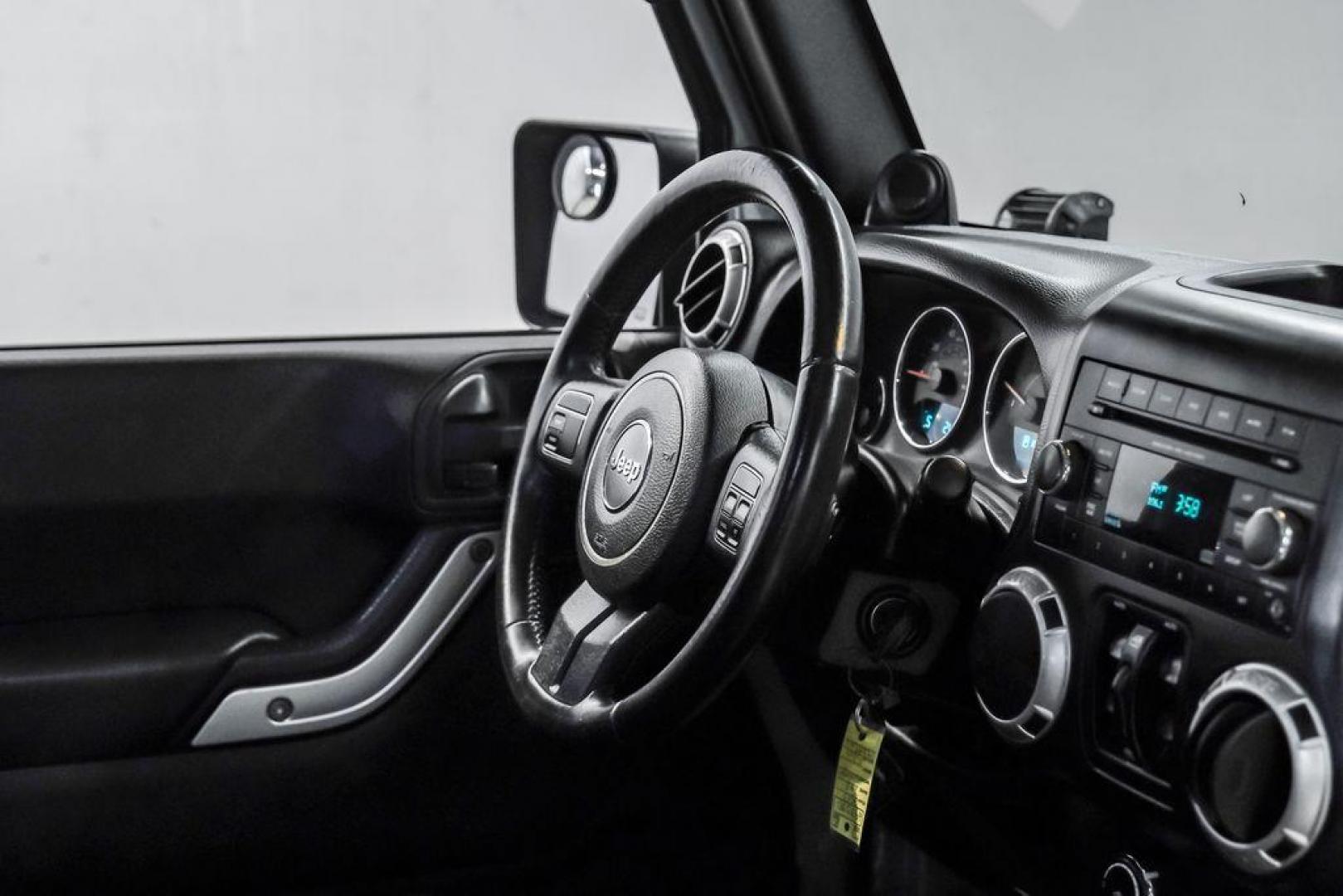 2013 Billet Metallic Clearcoat /Black Interior Jeep Wrangler Unlimited Sahara (1C4BJWEG8DL) with an 3.6L V6 24V VVT engine, Automatic transmission, located at 15300 Midway Rd., Addison, TX, 75001, (972) 702-0011, 32.958321, -96.838074 - Photo#18