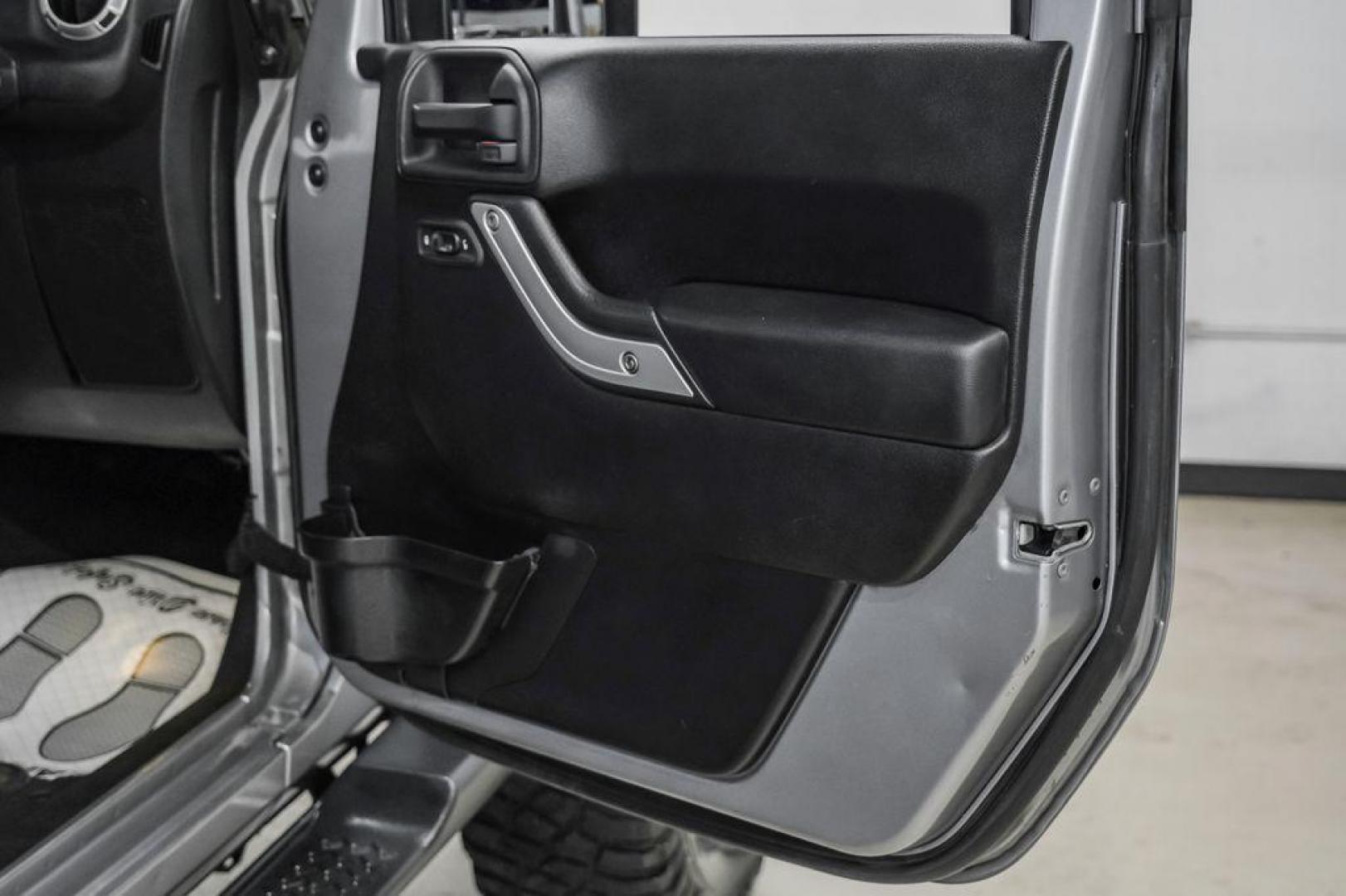 2013 Billet Metallic Clearcoat /Black Interior Jeep Wrangler Unlimited Sahara (1C4BJWEG8DL) with an 3.6L V6 24V VVT engine, Automatic transmission, located at 15300 Midway Rd., Addison, TX, 75001, (972) 702-0011, 32.958321, -96.838074 - Photo#42