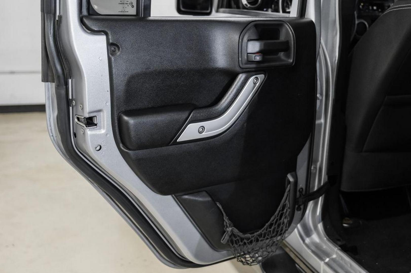 2013 Billet Metallic Clearcoat /Black Interior Jeep Wrangler Unlimited Sahara (1C4BJWEG8DL) with an 3.6L V6 24V VVT engine, Automatic transmission, located at 15300 Midway Rd., Addison, TX, 75001, (972) 702-0011, 32.958321, -96.838074 - Photo#43