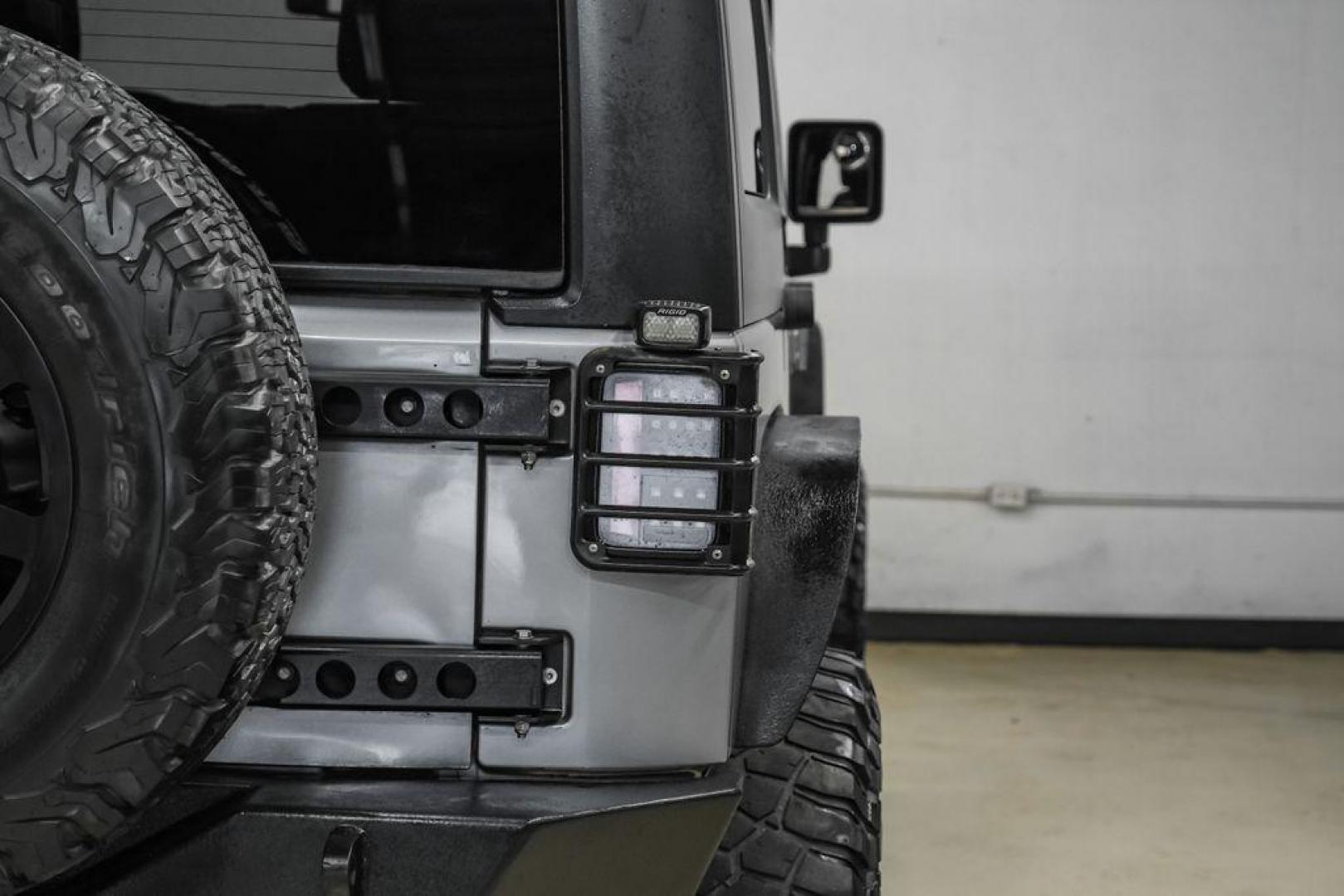 2013 Billet Metallic Clearcoat /Black Interior Jeep Wrangler Unlimited Sahara (1C4BJWEG8DL) with an 3.6L V6 24V VVT engine, Automatic transmission, located at 15300 Midway Rd., Addison, TX, 75001, (972) 702-0011, 32.958321, -96.838074 - Photo#46