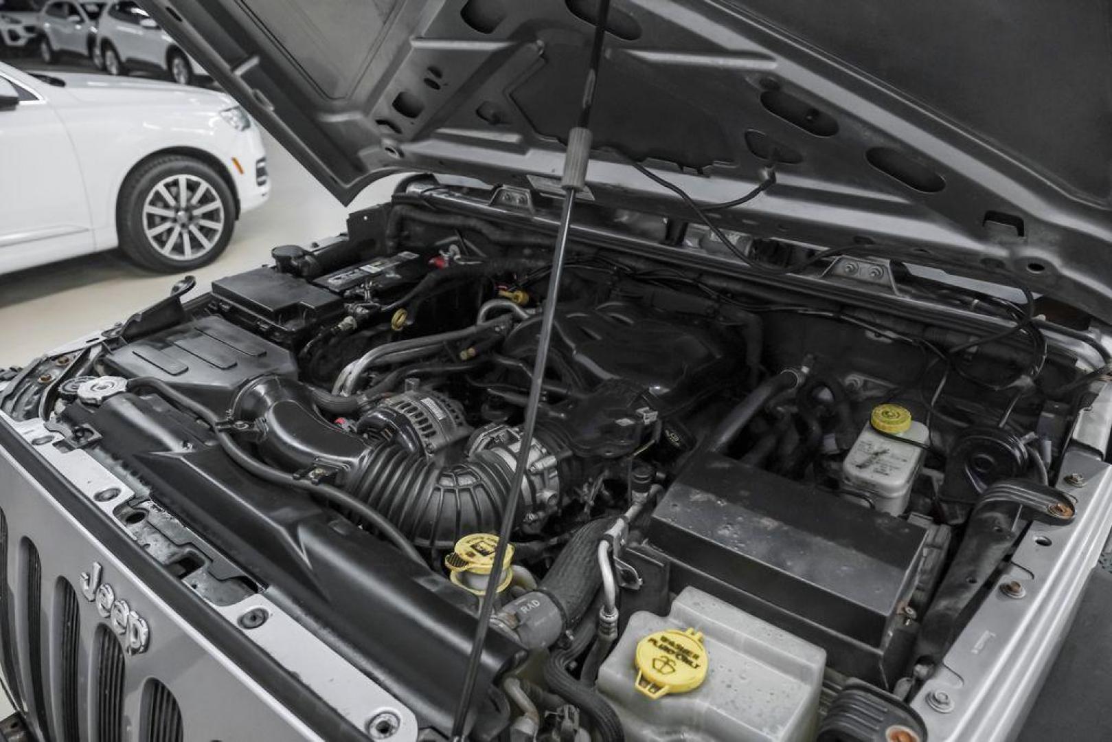 2013 Billet Metallic Clearcoat /Black Interior Jeep Wrangler Unlimited Sahara (1C4BJWEG8DL) with an 3.6L V6 24V VVT engine, Automatic transmission, located at 15300 Midway Rd., Addison, TX, 75001, (972) 702-0011, 32.958321, -96.838074 - Photo#47