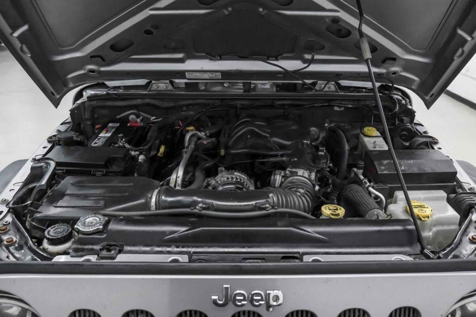 2013 Billet Metallic Clearcoat /Black Interior Jeep Wrangler Unlimited Sahara (1C4BJWEG8DL) with an 3.6L V6 24V VVT engine, Automatic transmission, located at 15300 Midway Rd., Addison, TX, 75001, (972) 702-0011, 32.958321, -96.838074 - Photo#48