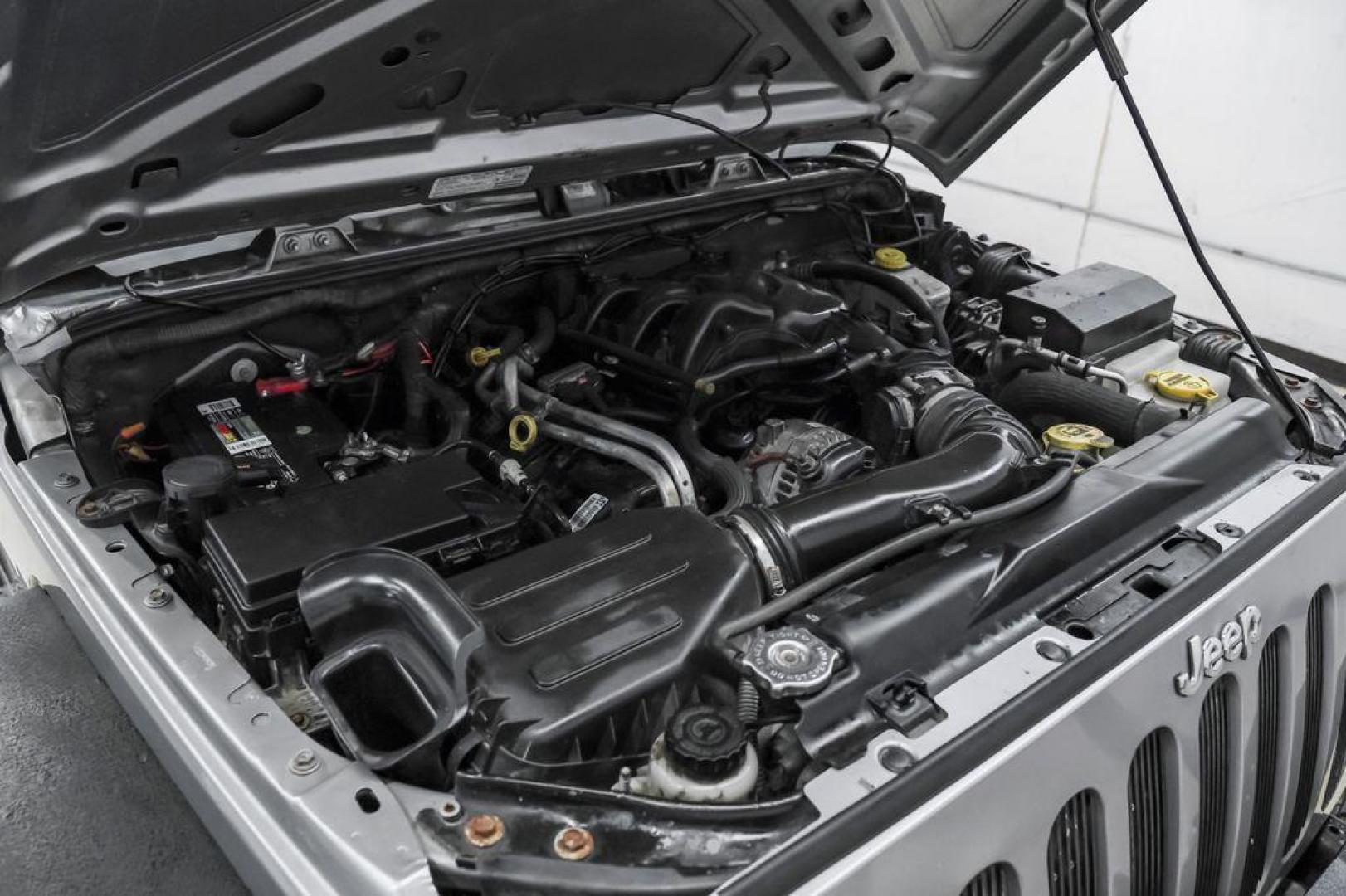 2013 Billet Metallic Clearcoat /Black Interior Jeep Wrangler Unlimited Sahara (1C4BJWEG8DL) with an 3.6L V6 24V VVT engine, Automatic transmission, located at 15300 Midway Rd., Addison, TX, 75001, (972) 702-0011, 32.958321, -96.838074 - Photo#49