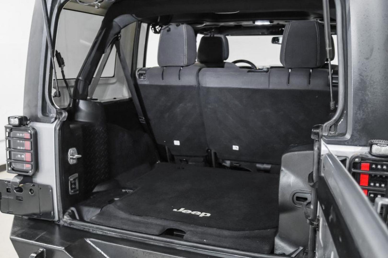 2013 Billet Metallic Clearcoat /Black Interior Jeep Wrangler Unlimited Sahara (1C4BJWEG8DL) with an 3.6L V6 24V VVT engine, Automatic transmission, located at 15300 Midway Rd., Addison, TX, 75001, (972) 702-0011, 32.958321, -96.838074 - Photo#50