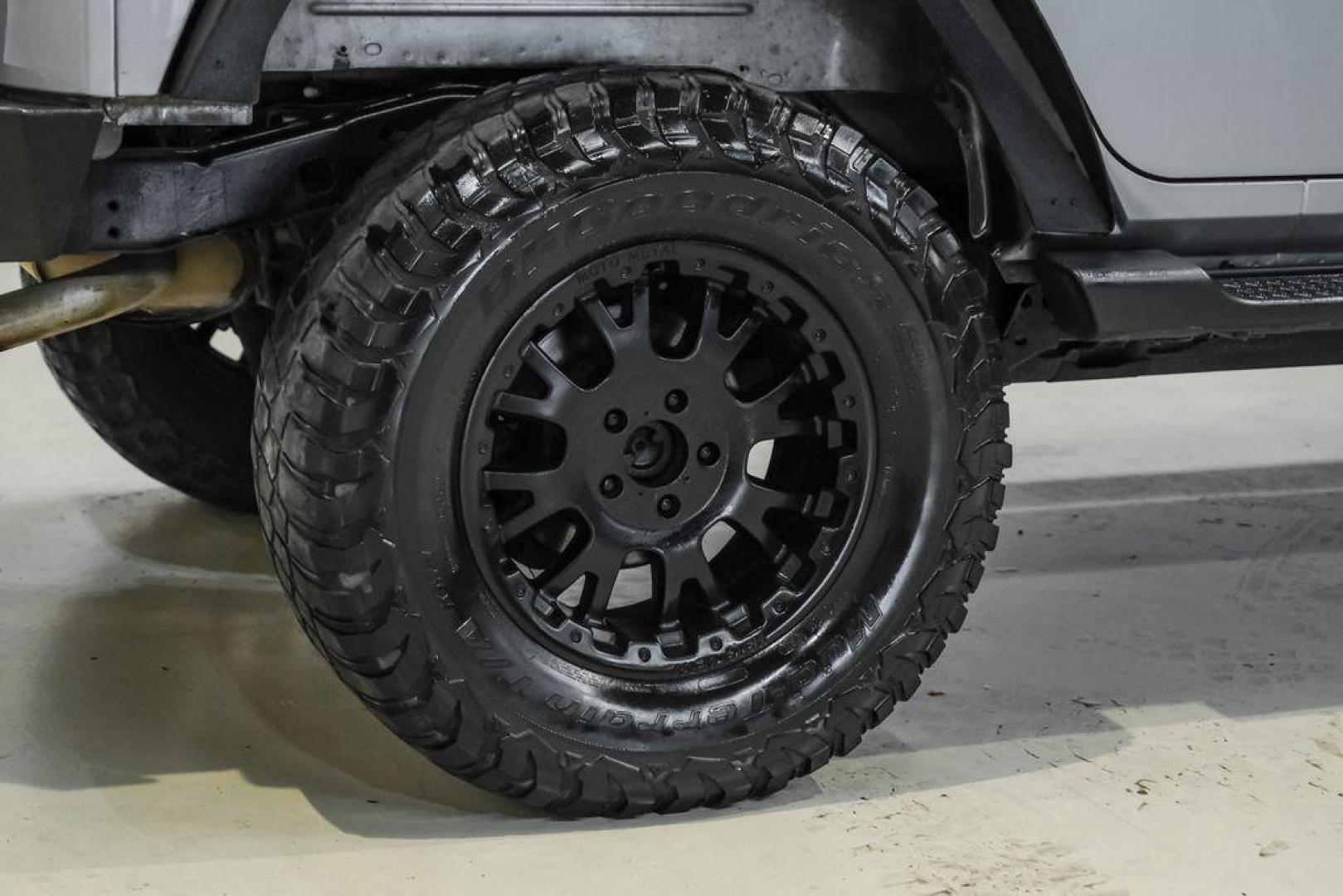 2013 Billet Metallic Clearcoat /Black Interior Jeep Wrangler Unlimited Sahara (1C4BJWEG8DL) with an 3.6L V6 24V VVT engine, Automatic transmission, located at 15300 Midway Rd., Addison, TX, 75001, (972) 702-0011, 32.958321, -96.838074 - Photo#52