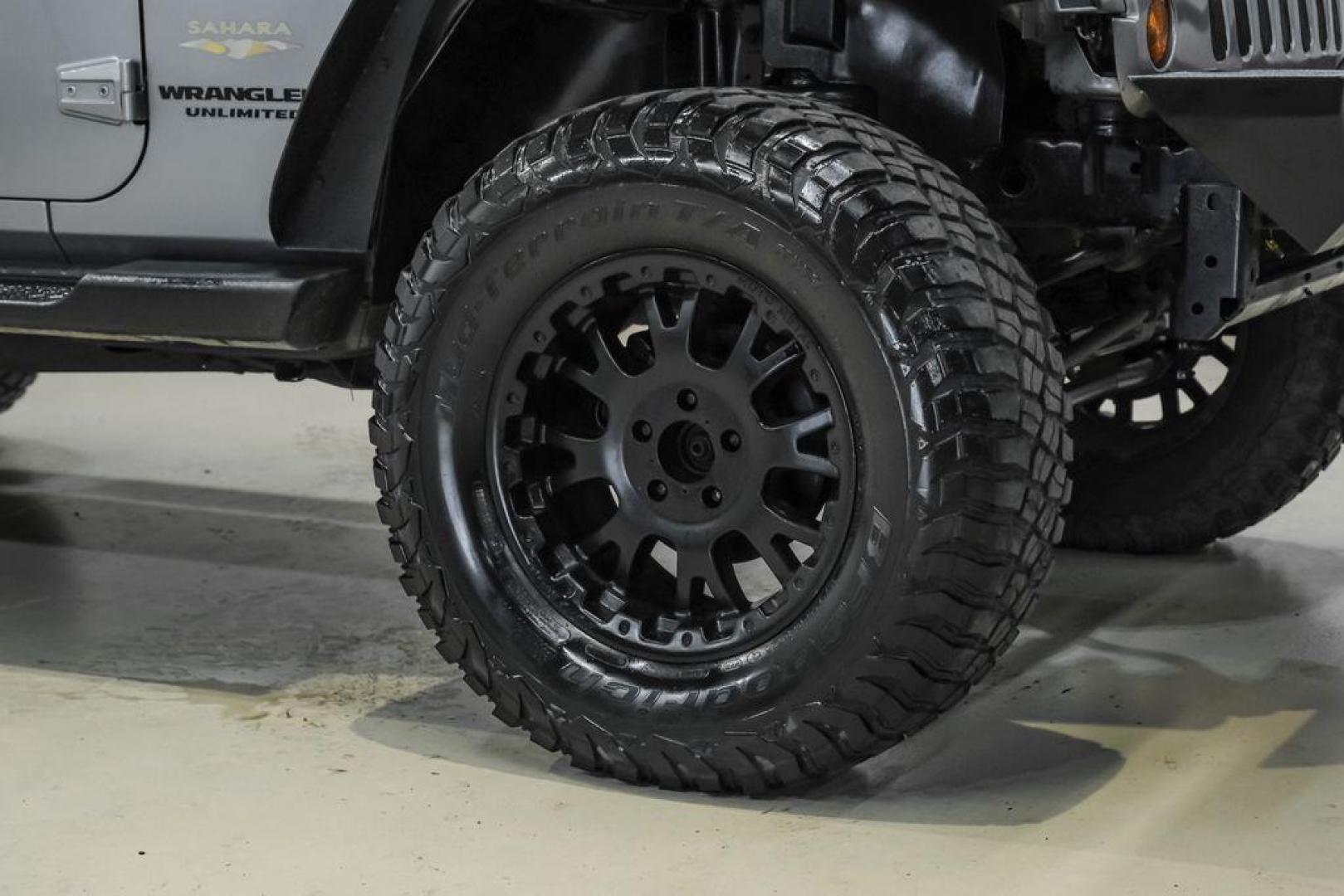 2013 Billet Metallic Clearcoat /Black Interior Jeep Wrangler Unlimited Sahara (1C4BJWEG8DL) with an 3.6L V6 24V VVT engine, Automatic transmission, located at 15300 Midway Rd., Addison, TX, 75001, (972) 702-0011, 32.958321, -96.838074 - Photo#53