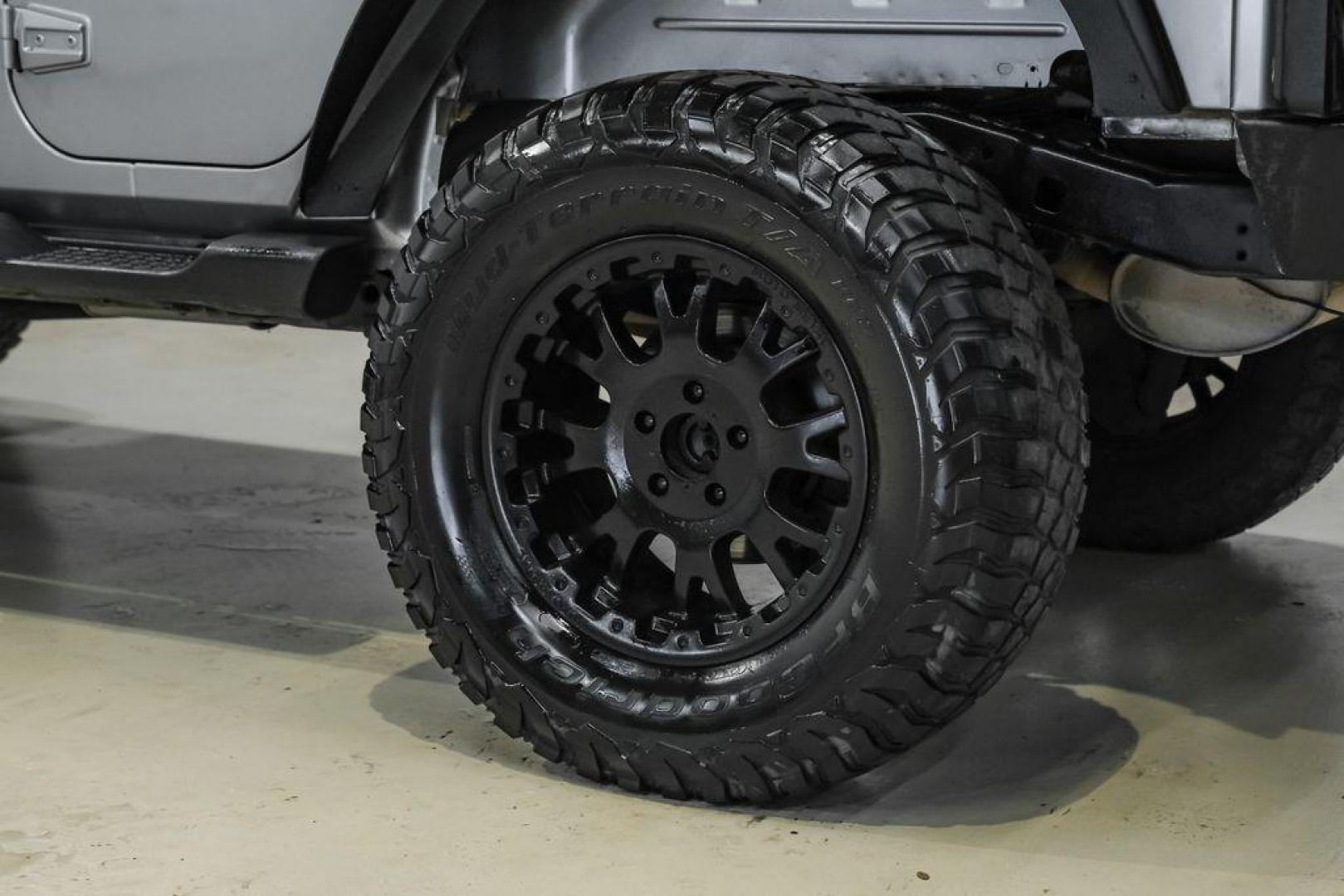 2013 Billet Metallic Clearcoat /Black Interior Jeep Wrangler Unlimited Sahara (1C4BJWEG8DL) with an 3.6L V6 24V VVT engine, Automatic transmission, located at 15300 Midway Rd., Addison, TX, 75001, (972) 702-0011, 32.958321, -96.838074 - Photo#55