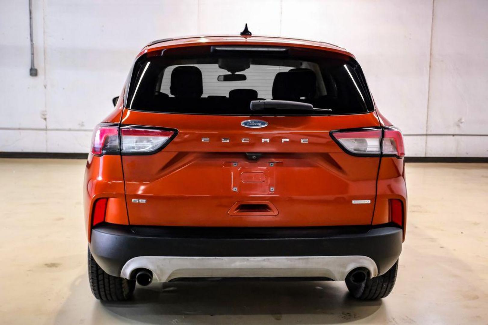2020 Orange Metallic /Dark Earth Gray Ford Escape SE (1FMCU0G62LU) with an 1.5L EcoBoost engine, Automatic transmission, located at 15300 Midway Rd., Addison, TX, 75001, (972) 702-0011, 32.958321, -96.838074 - Photo#8