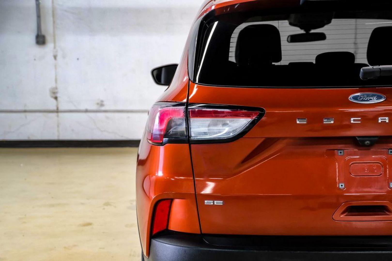 2020 Orange Metallic /Dark Earth Gray Ford Escape SE (1FMCU0G62LU) with an 1.5L EcoBoost engine, Automatic transmission, located at 15300 Midway Rd., Addison, TX, 75001, (972) 702-0011, 32.958321, -96.838074 - Photo#44