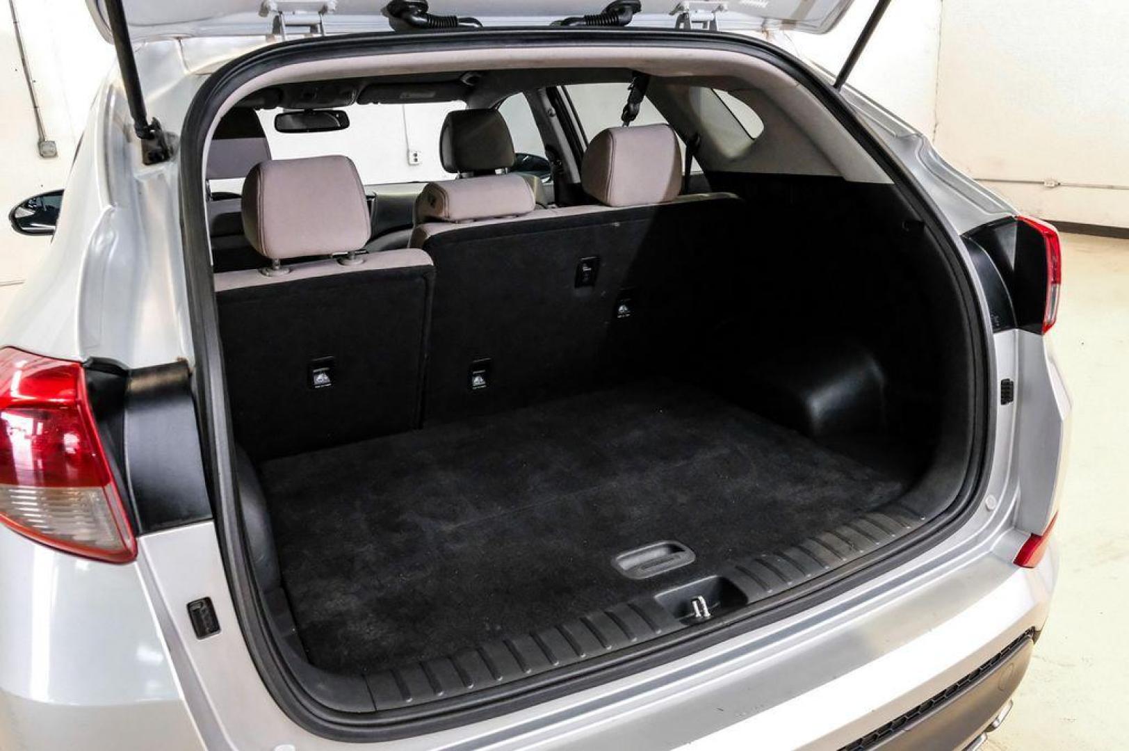 2016 Molten Silver /Gray Hyundai Tucson Eco (KM8J33A28GU) with an 1.6L I4 DGI Turbocharged DOHC 16V ULEV II 175hp engine, Automatic transmission, located at 15300 Midway Rd., Addison, TX, 75001, (972) 702-0011, 32.958321, -96.838074 - Photo#65