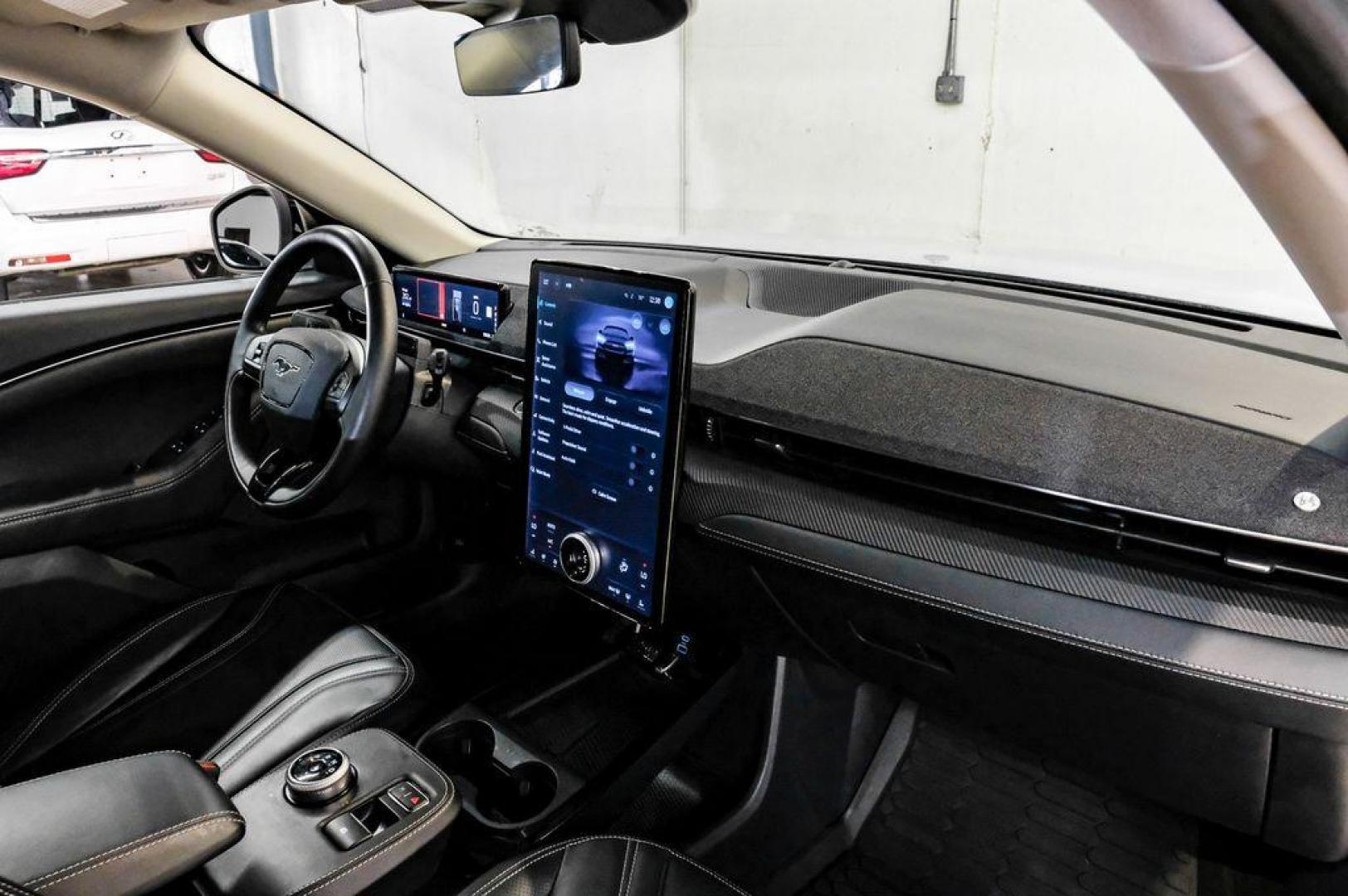 2023 White Metallic /Black Onyx Ford Mustang Mach-E Premium (3FMTK3R71PM) with an Electric Motor engine, Automatic transmission, located at 15300 Midway Rd., Addison, TX, 75001, (972) 702-0011, 32.958321, -96.838074 - Photo#19