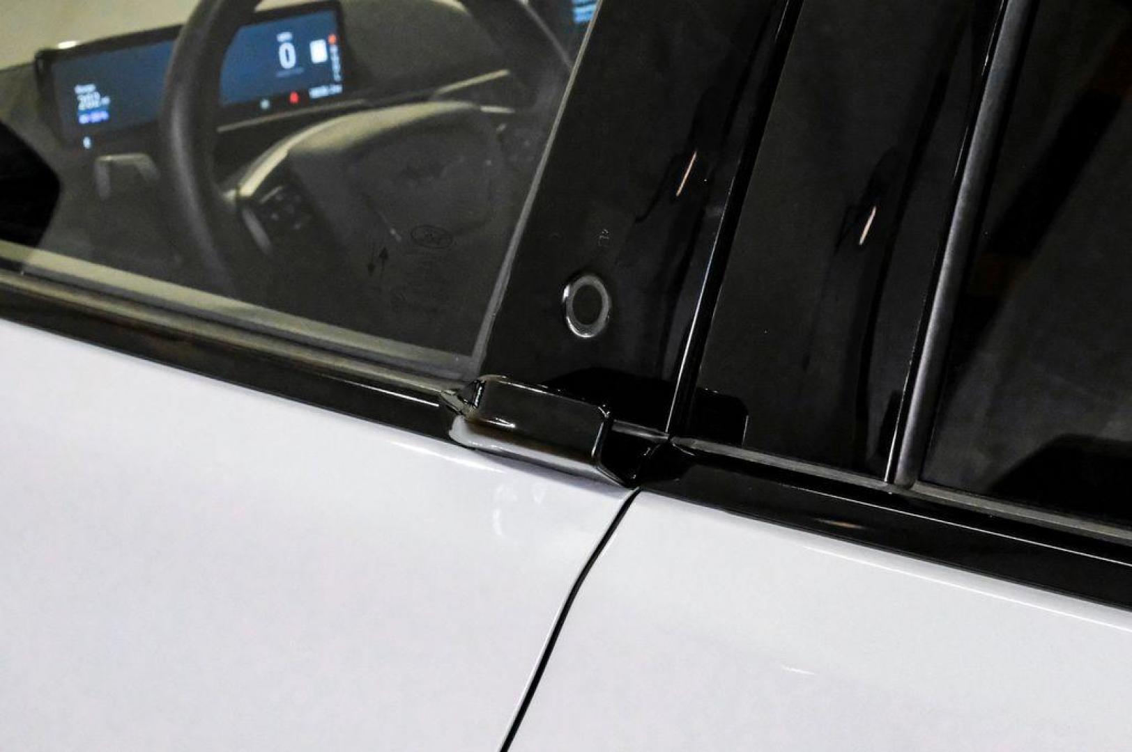 2023 White Metallic /Black Onyx Ford Mustang Mach-E Premium (3FMTK3R71PM) with an Electric Motor engine, Automatic transmission, located at 15300 Midway Rd., Addison, TX, 75001, (972) 702-0011, 32.958321, -96.838074 - Photo#46