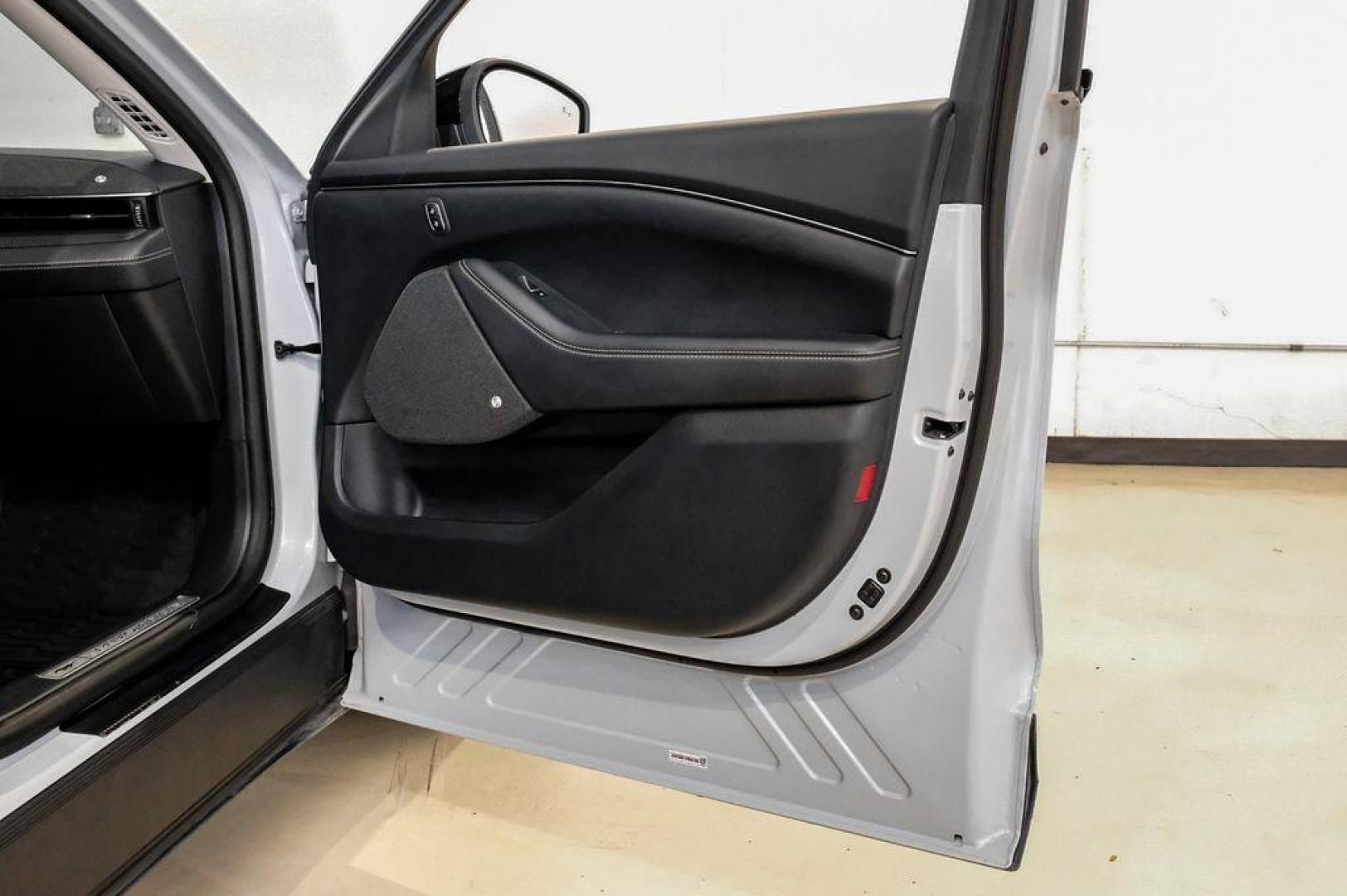 2023 White Metallic /Black Onyx Ford Mustang Mach-E Premium (3FMTK3R71PM) with an Electric Motor engine, Automatic transmission, located at 15300 Midway Rd., Addison, TX, 75001, (972) 702-0011, 32.958321, -96.838074 - Photo#50