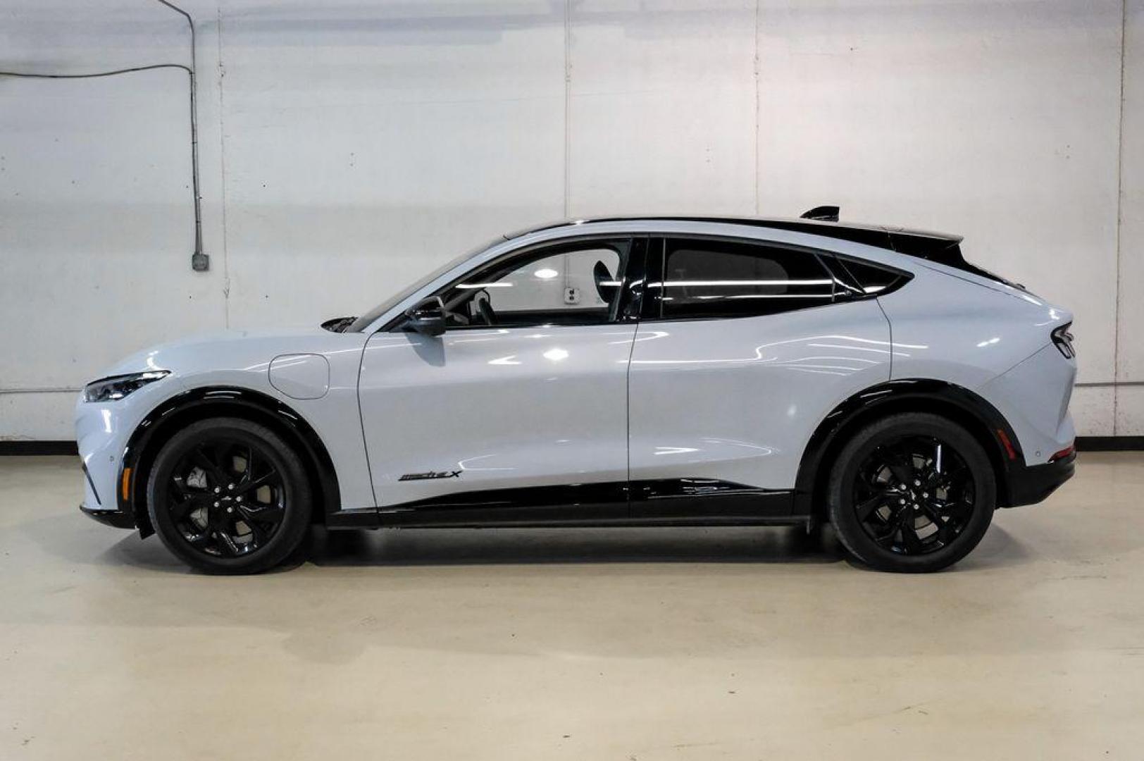 2023 White Metallic /Black Onyx Ford Mustang Mach-E Premium (3FMTK3R71PM) with an Electric Motor engine, Automatic transmission, located at 15300 Midway Rd., Addison, TX, 75001, (972) 702-0011, 32.958321, -96.838074 - Photo#13
