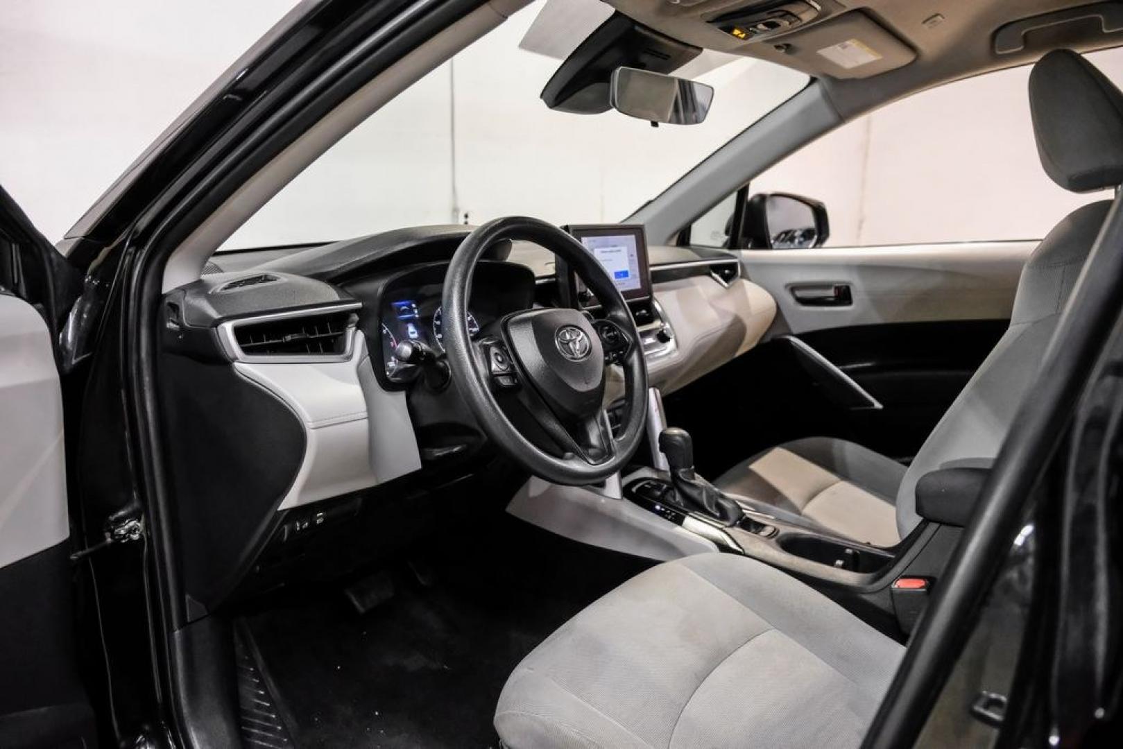 2023 Jet Black /Gray Toyota Corolla Cross L (7MUAAAAG1PV) with an 2.0L I4 PDI DOHC 16V LEV3-SULEV30 169hp engine, CVT transmission, located at 15300 Midway Rd., Addison, TX, 75001, (972) 702-0011, 32.958321, -96.838074 - Photo#2
