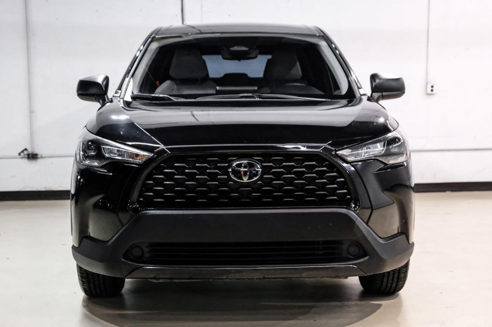 2023 Jet Black /Gray Toyota Corolla Cross L (7MUAAAAG1PV) with an 2.0L I4 PDI DOHC 16V LEV3-SULEV30 169hp engine, CVT transmission, located at 15300 Midway Rd., Addison, TX, 75001, (972) 702-0011, 32.958321, -96.838074 - Photo#4