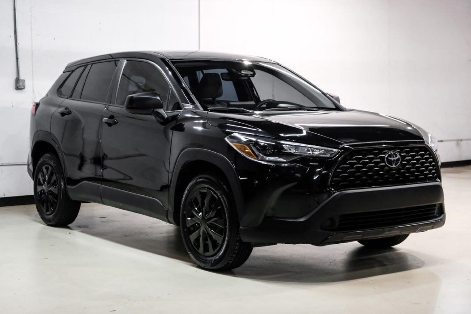 2023 Jet Black /Gray Toyota Corolla Cross L (7MUAAAAG1PV) with an 2.0L I4 PDI DOHC 16V LEV3-SULEV30 169hp engine, CVT transmission, located at 15300 Midway Rd., Addison, TX, 75001, (972) 702-0011, 32.958321, -96.838074 - Photo#5