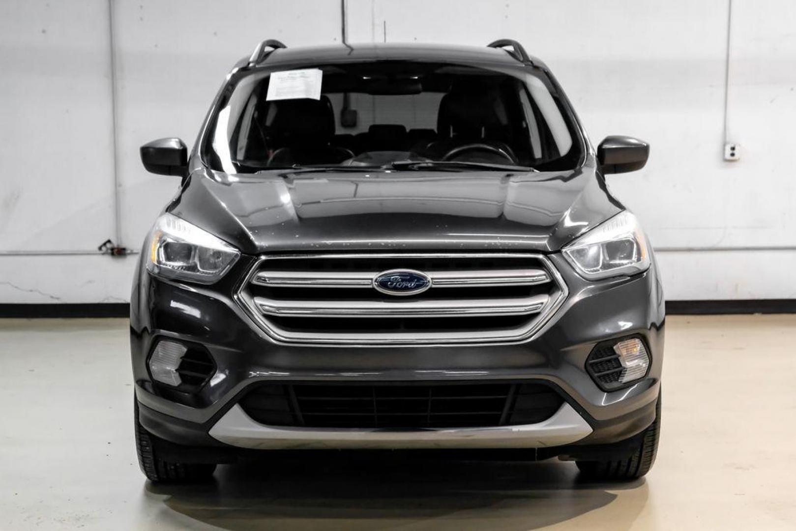 2018 Magnetic Metallic /Charcoal Black Ford Escape SEL (1FMCU9H92JU) with an EcoBoost 2.0L I4 GTDi DOHC Turbocharged VCT engine, Automatic transmission, located at 15300 Midway Rd., Addison, TX, 75001, (972) 702-0011, 32.958321, -96.838074 - Photo#4