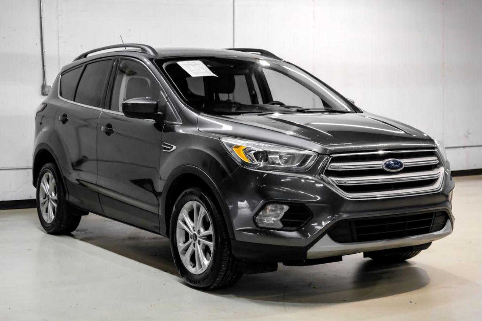 2018 Magnetic Metallic /Charcoal Black Ford Escape SEL (1FMCU9H92JU) with an EcoBoost 2.0L I4 GTDi DOHC Turbocharged VCT engine, Automatic transmission, located at 15300 Midway Rd., Addison, TX, 75001, (972) 702-0011, 32.958321, -96.838074 - Photo#5