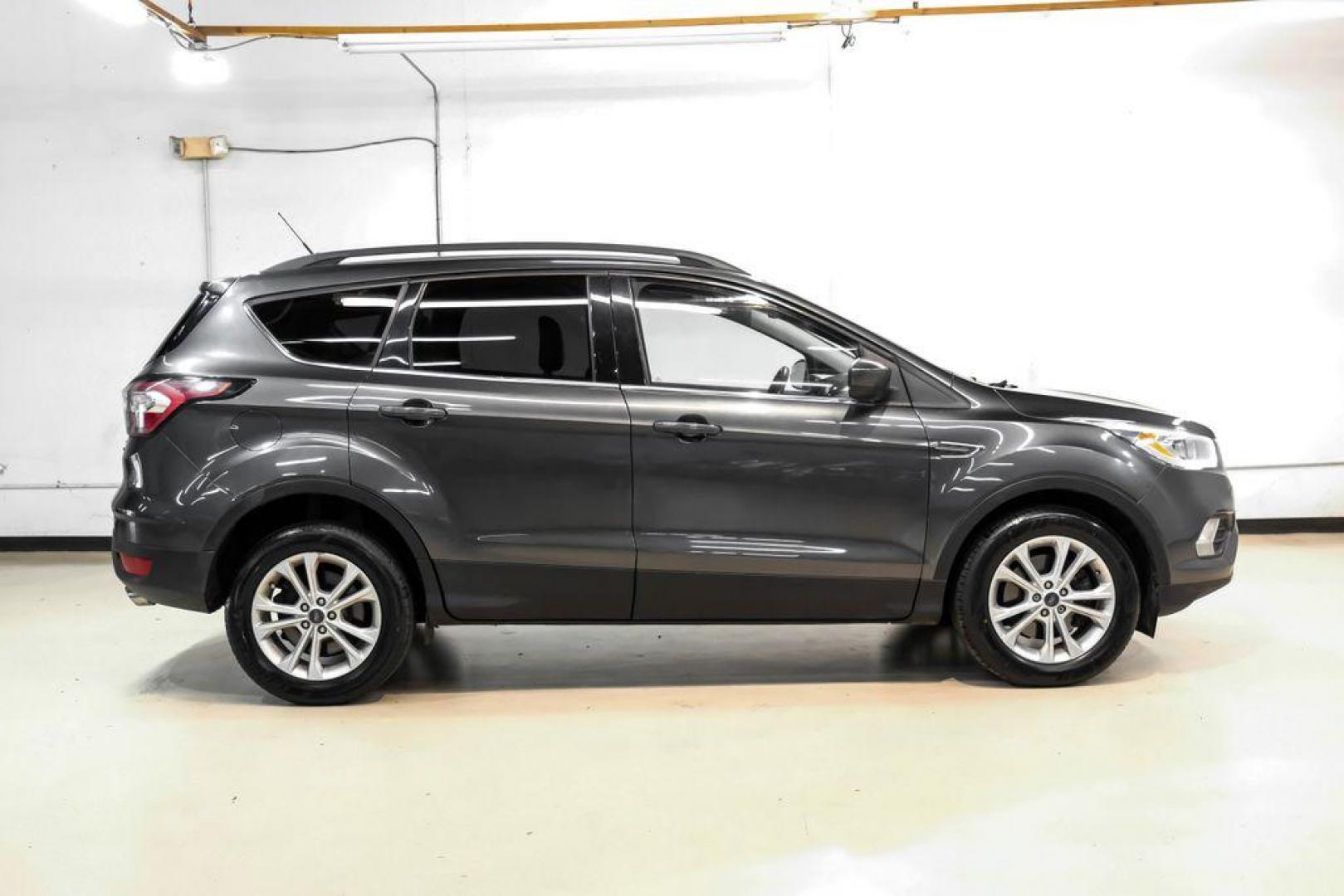 2018 Magnetic Metallic /Charcoal Black Ford Escape SEL (1FMCU9H92JU) with an EcoBoost 2.0L I4 GTDi DOHC Turbocharged VCT engine, Automatic transmission, located at 15300 Midway Rd., Addison, TX, 75001, (972) 702-0011, 32.958321, -96.838074 - Photo#6