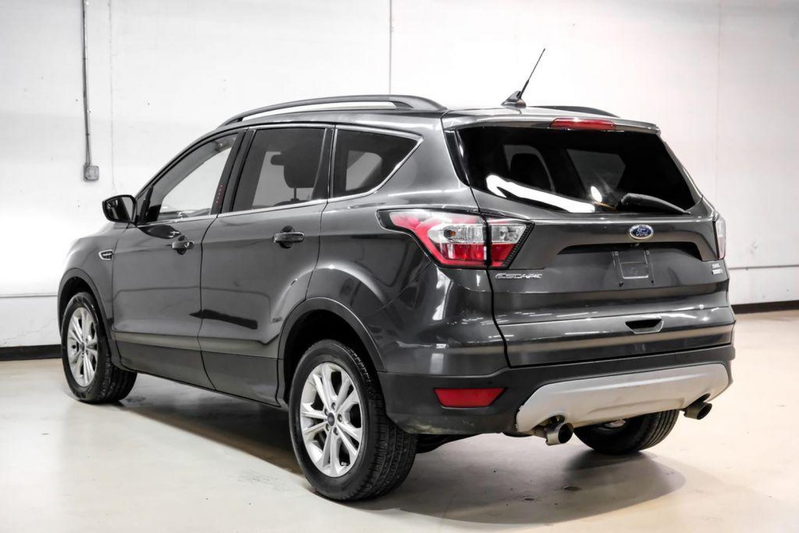 2018 Magnetic Metallic /Charcoal Black Ford Escape SEL (1FMCU9H92JU) with an EcoBoost 2.0L I4 GTDi DOHC Turbocharged VCT engine, Automatic transmission, located at 15300 Midway Rd., Addison, TX, 75001, (972) 702-0011, 32.958321, -96.838074 - Photo#9