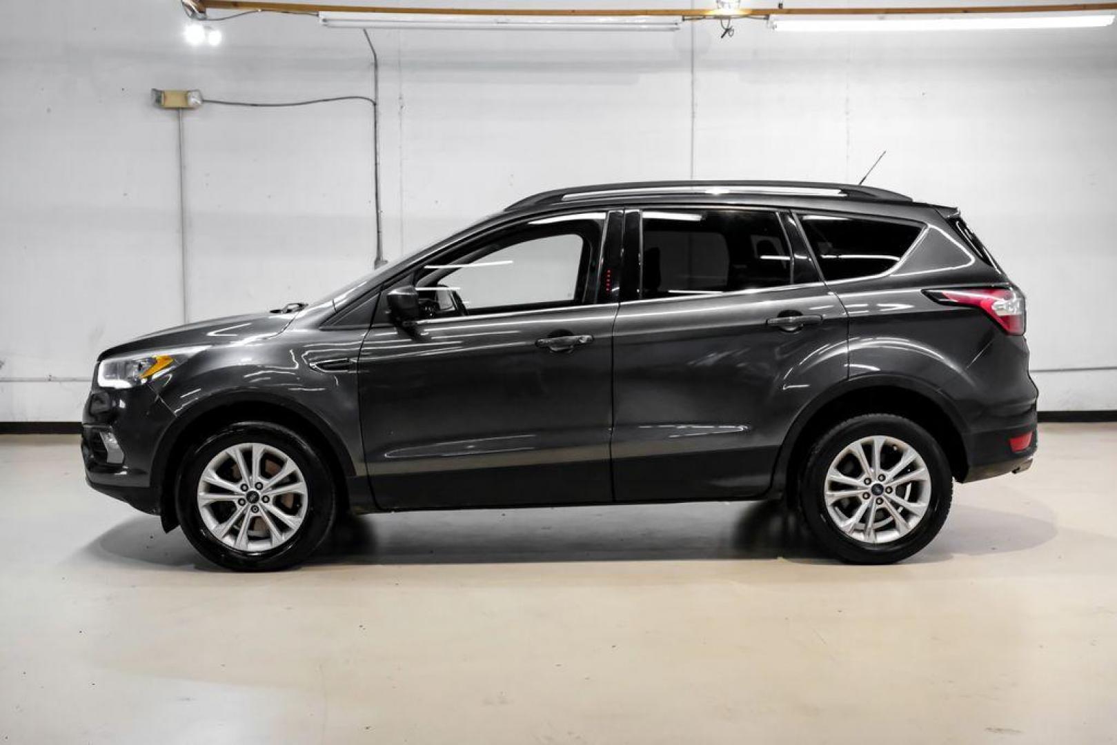 2018 Magnetic Metallic /Charcoal Black Ford Escape SEL (1FMCU9H92JU) with an EcoBoost 2.0L I4 GTDi DOHC Turbocharged VCT engine, Automatic transmission, located at 15300 Midway Rd., Addison, TX, 75001, (972) 702-0011, 32.958321, -96.838074 - Photo#10