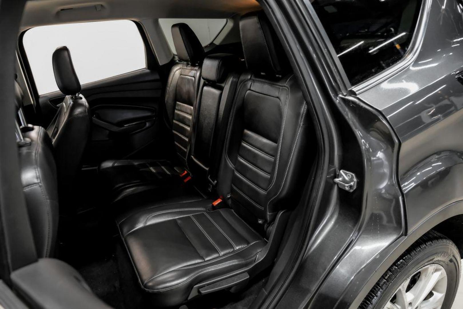 2018 Magnetic Metallic /Charcoal Black Ford Escape SEL (1FMCU9H92JU) with an EcoBoost 2.0L I4 GTDi DOHC Turbocharged VCT engine, Automatic transmission, located at 15300 Midway Rd., Addison, TX, 75001, (972) 702-0011, 32.958321, -96.838074 - Photo#36