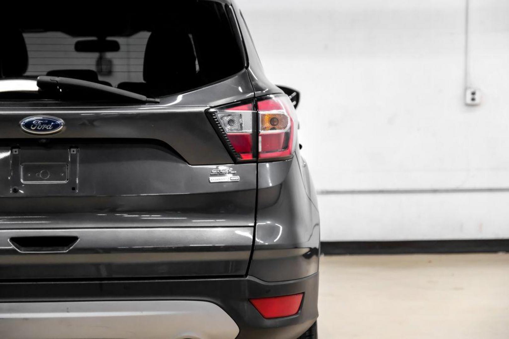 2018 Magnetic Metallic /Charcoal Black Ford Escape SEL (1FMCU9H92JU) with an EcoBoost 2.0L I4 GTDi DOHC Turbocharged VCT engine, Automatic transmission, located at 15300 Midway Rd., Addison, TX, 75001, (972) 702-0011, 32.958321, -96.838074 - Photo#45
