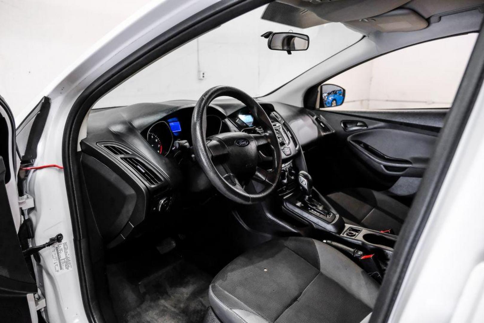 2014 Oxford White /Black Ford Focus S (1FADP3E24EL) with an 2.0L 4-Cylinder DGI Flex Fuel DOHC engine, Automatic transmission, located at 15300 Midway Rd., Addison, TX, 75001, (972) 702-0011, 32.958321, -96.838074 - Photo#2