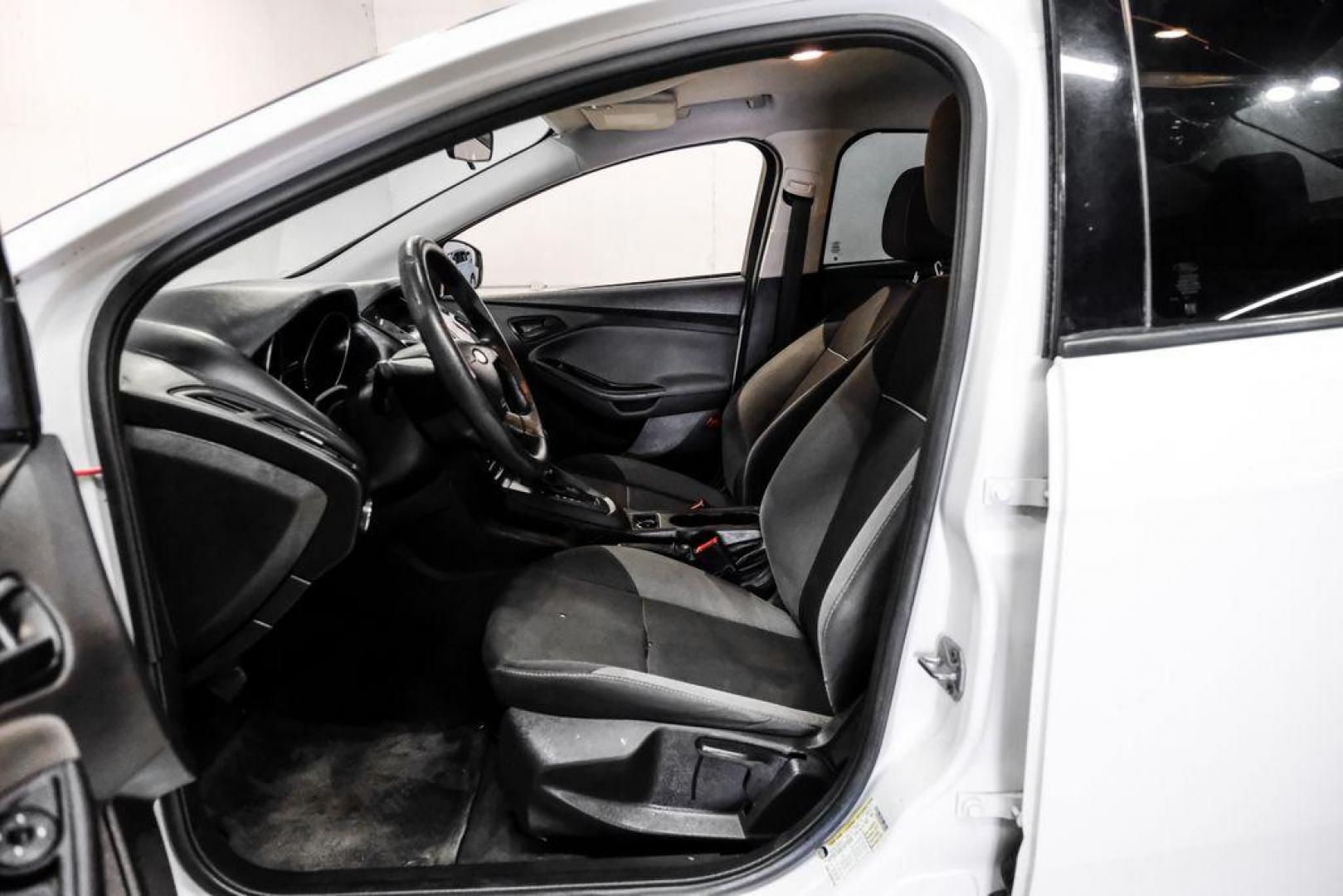 2014 Oxford White /Black Ford Focus S (1FADP3E24EL) with an 2.0L 4-Cylinder DGI Flex Fuel DOHC engine, Automatic transmission, located at 15300 Midway Rd., Addison, TX, 75001, (972) 702-0011, 32.958321, -96.838074 - Photo#3